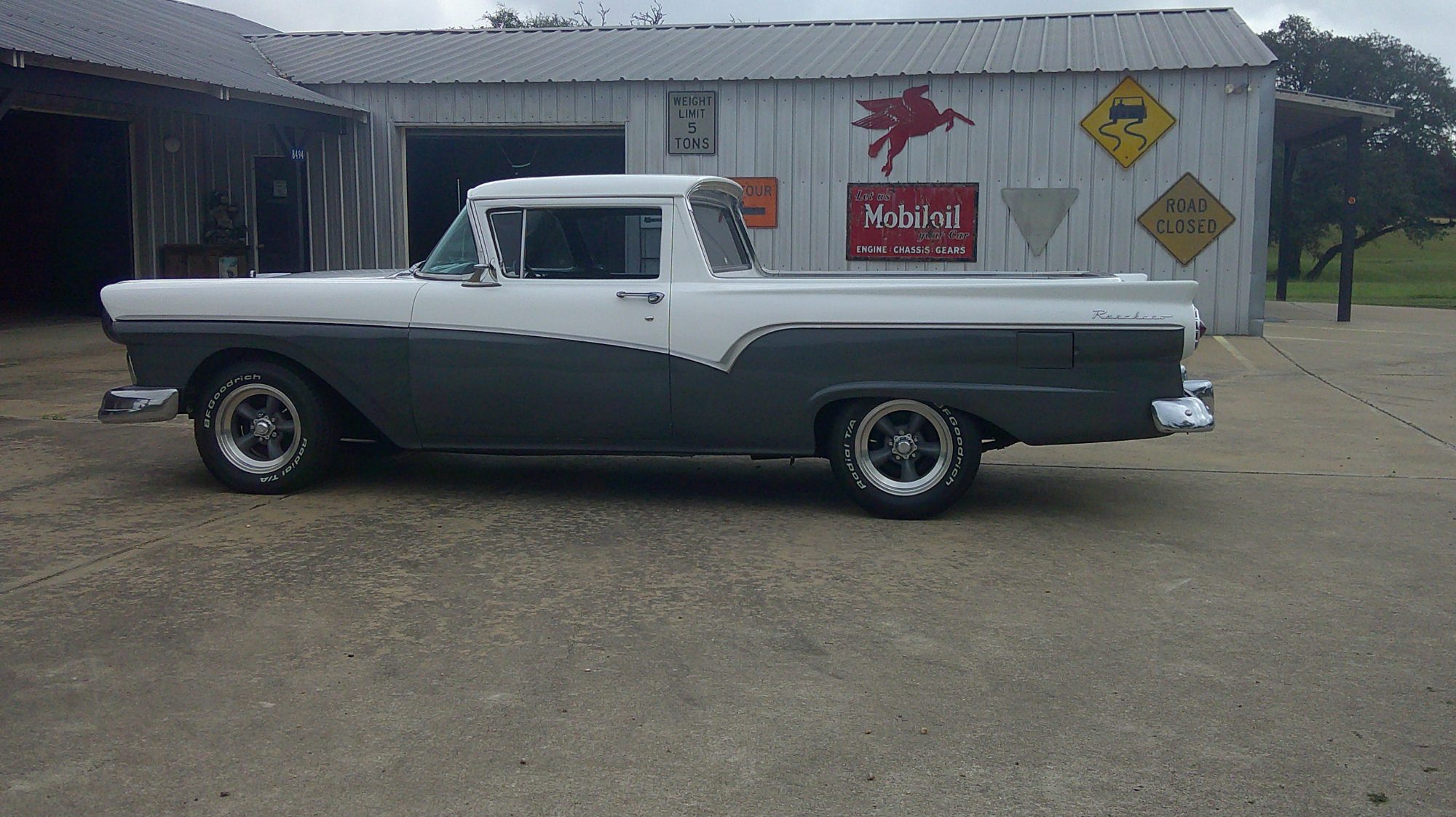 Left side profile of a two-tone white and gray Ford Ranchero.