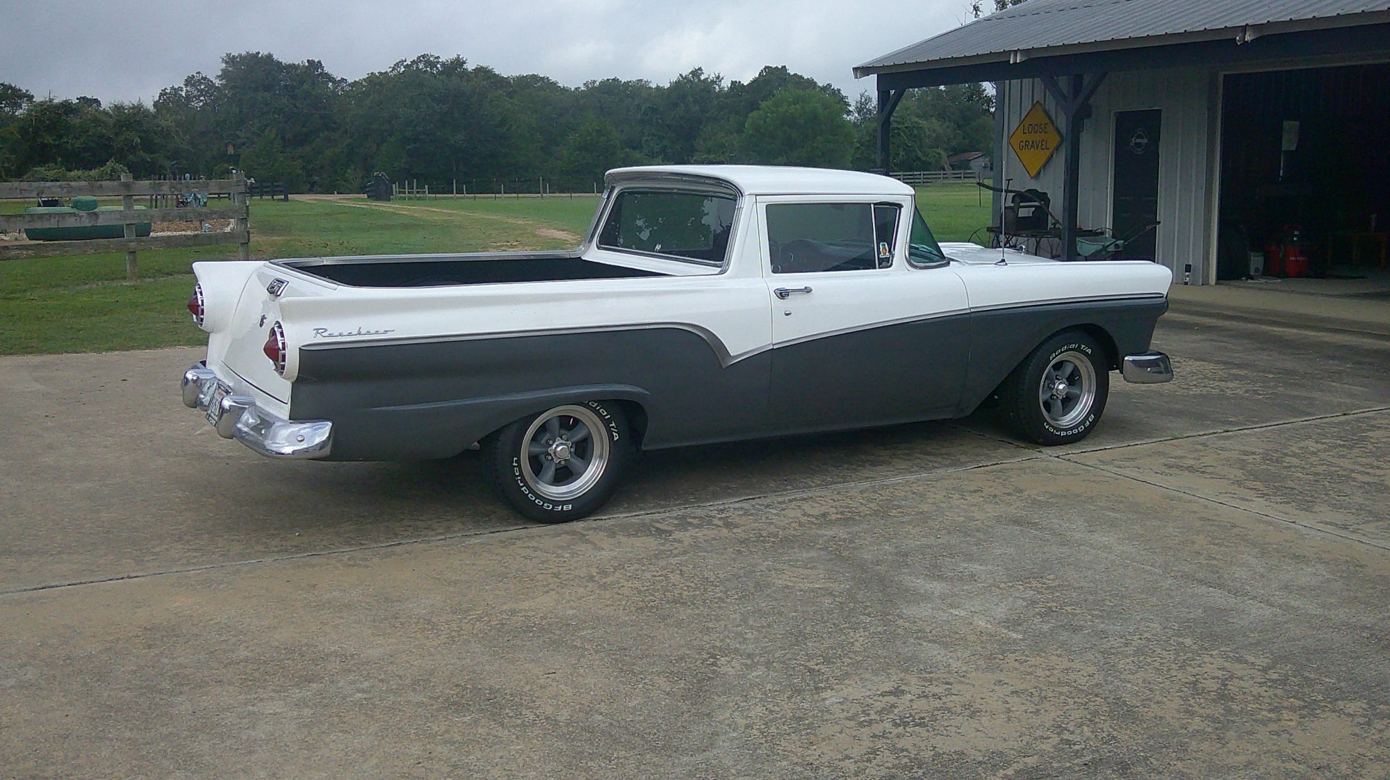 Rear three-quarter view of a two-tone white and grey Ford Ranchero.