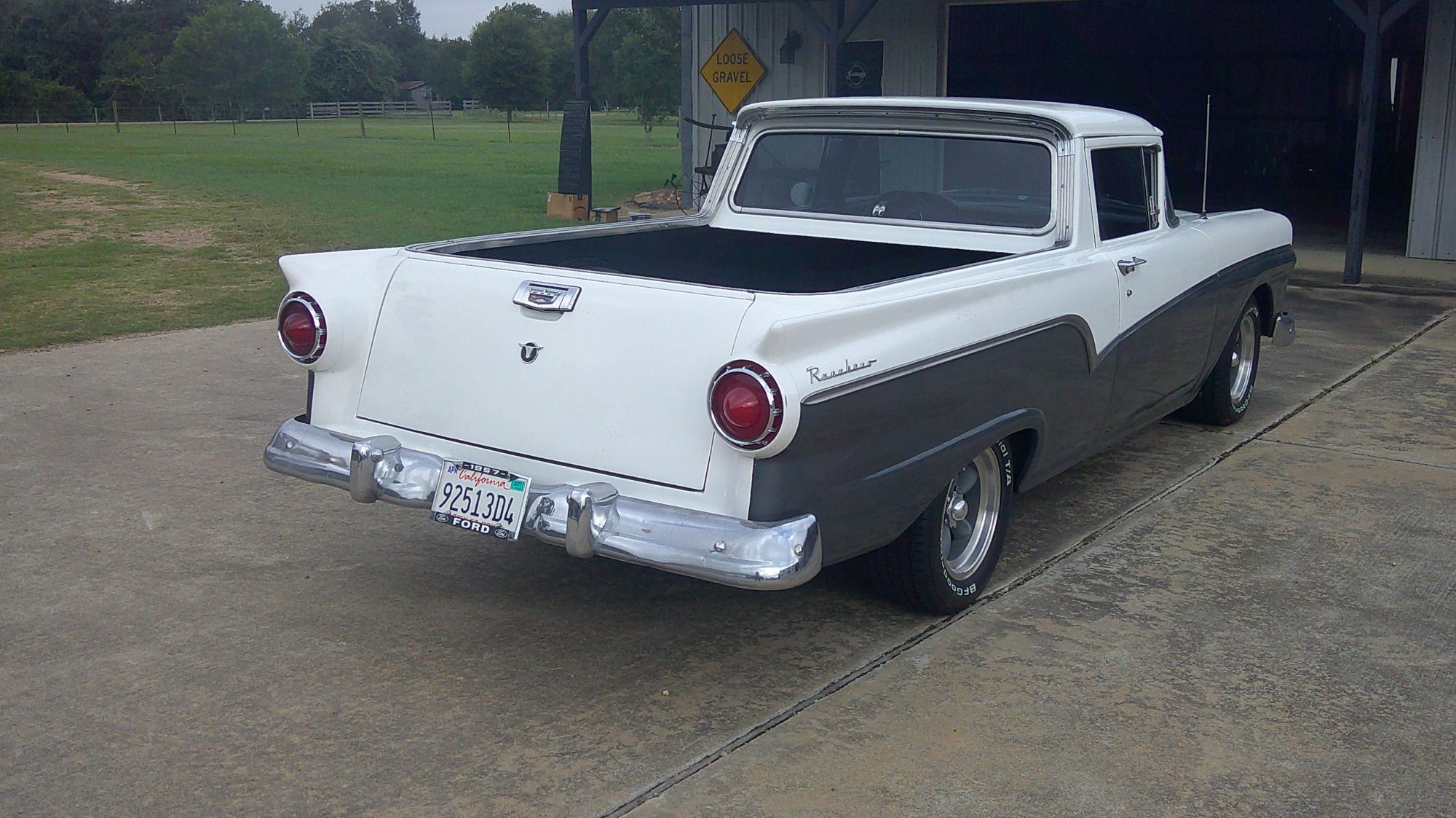 Rear three-quarter view of a two-tone white and grey Ford Ranchero.