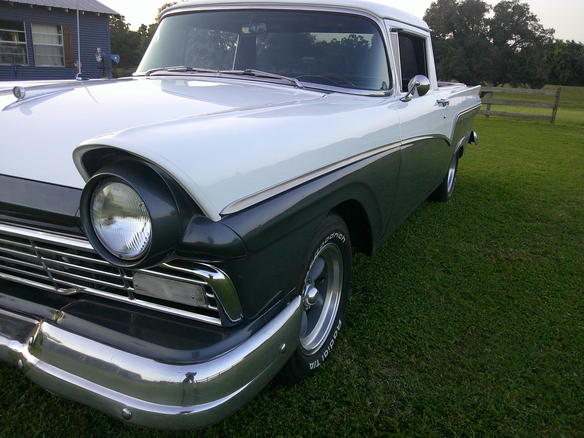 Front three-quarter view of a white and gray classic Ford Ranchero.