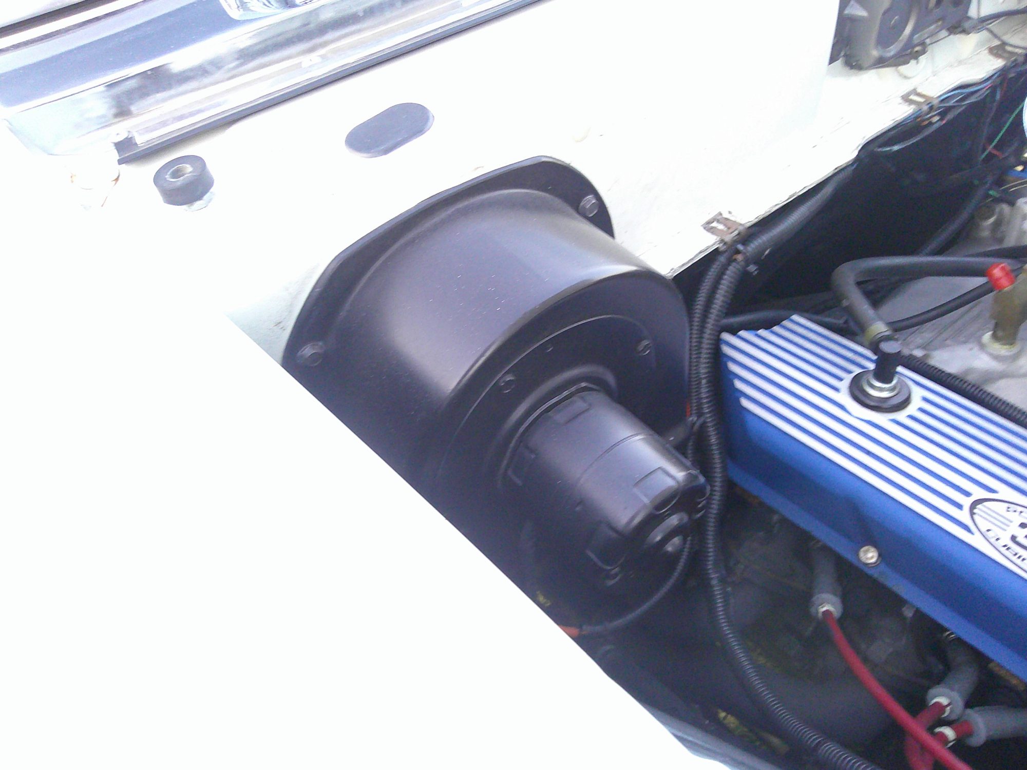 Blower motor and heater housing in engine bay