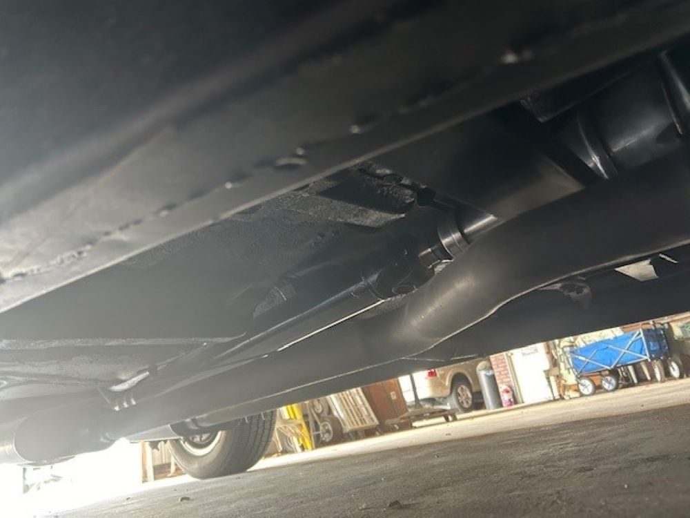 Underbody view showing the exhaust system and driveshaft.