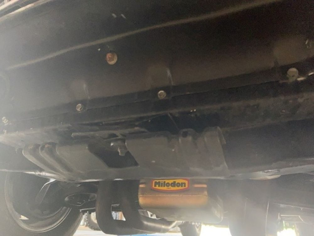 Underbody view showing Milodon oil pan and exhaust components.