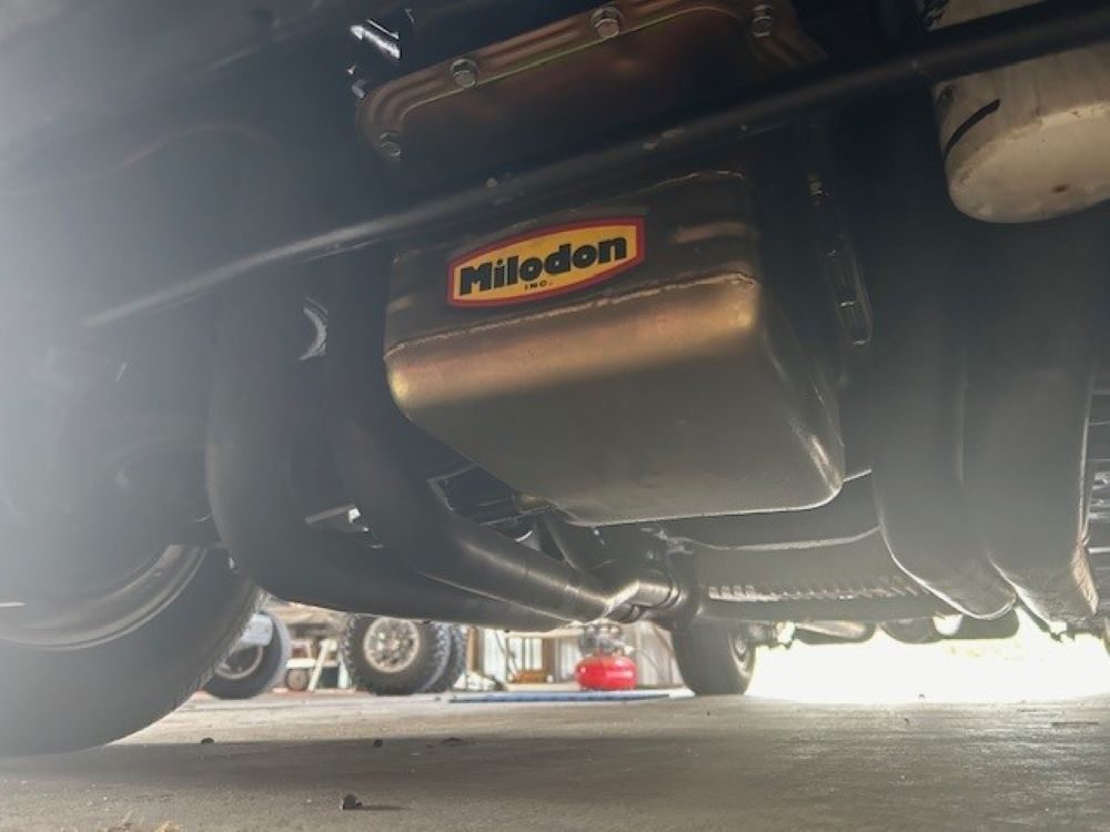 Underbody view showing Milodon oil pan and exhaust headers.