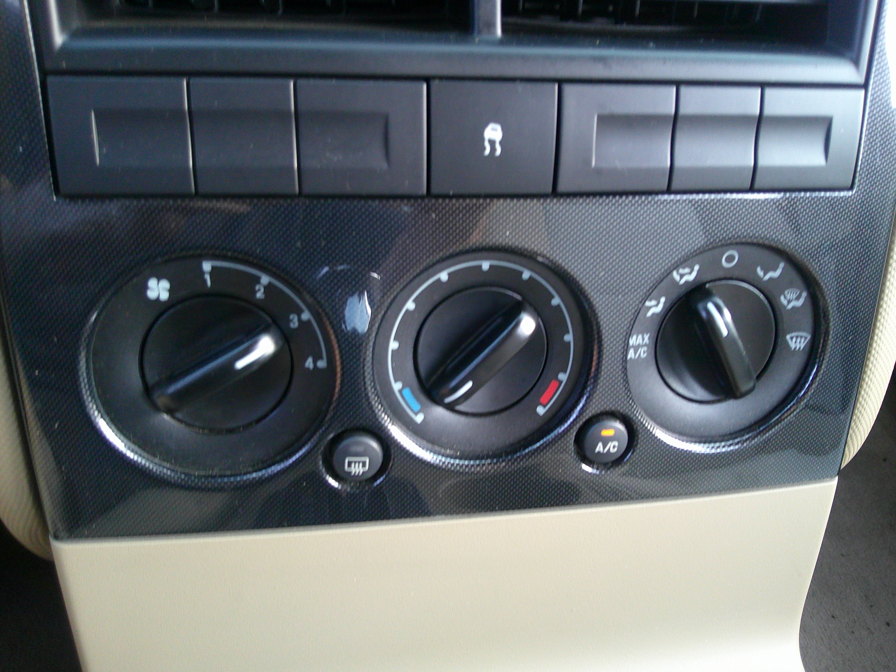 Center console climate control dials and switches