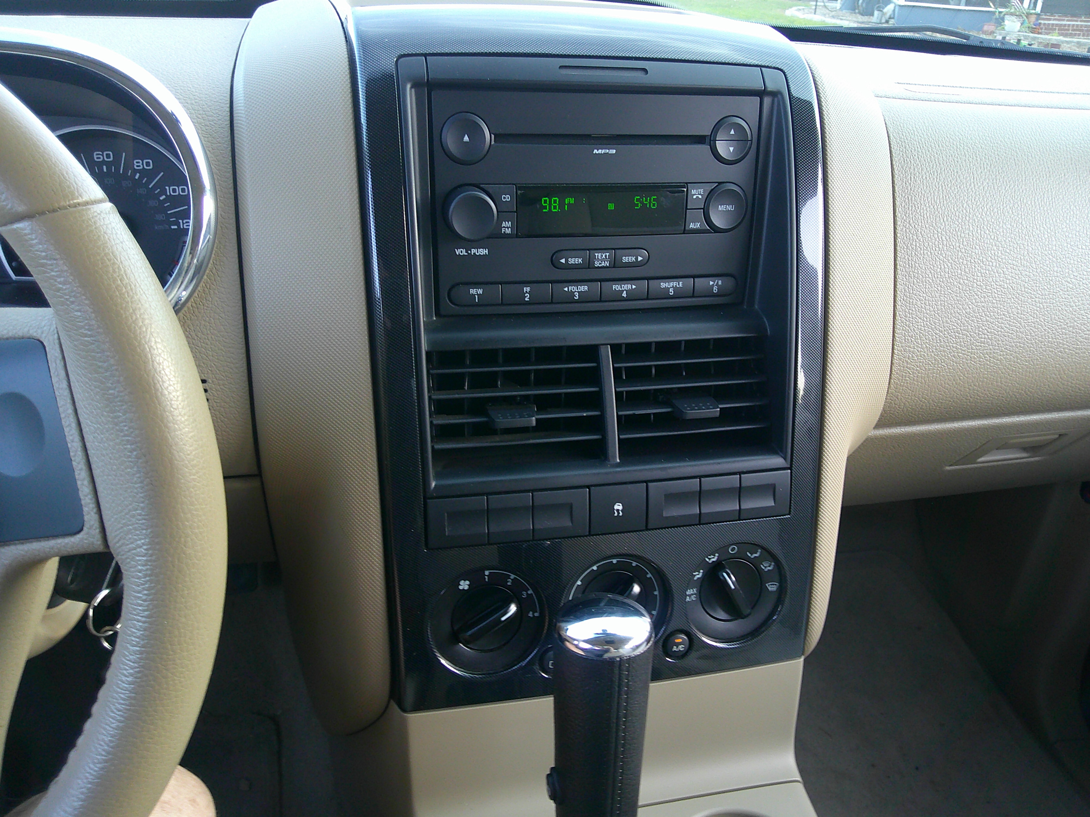 Center console with radio, climate controls, and gear selector.