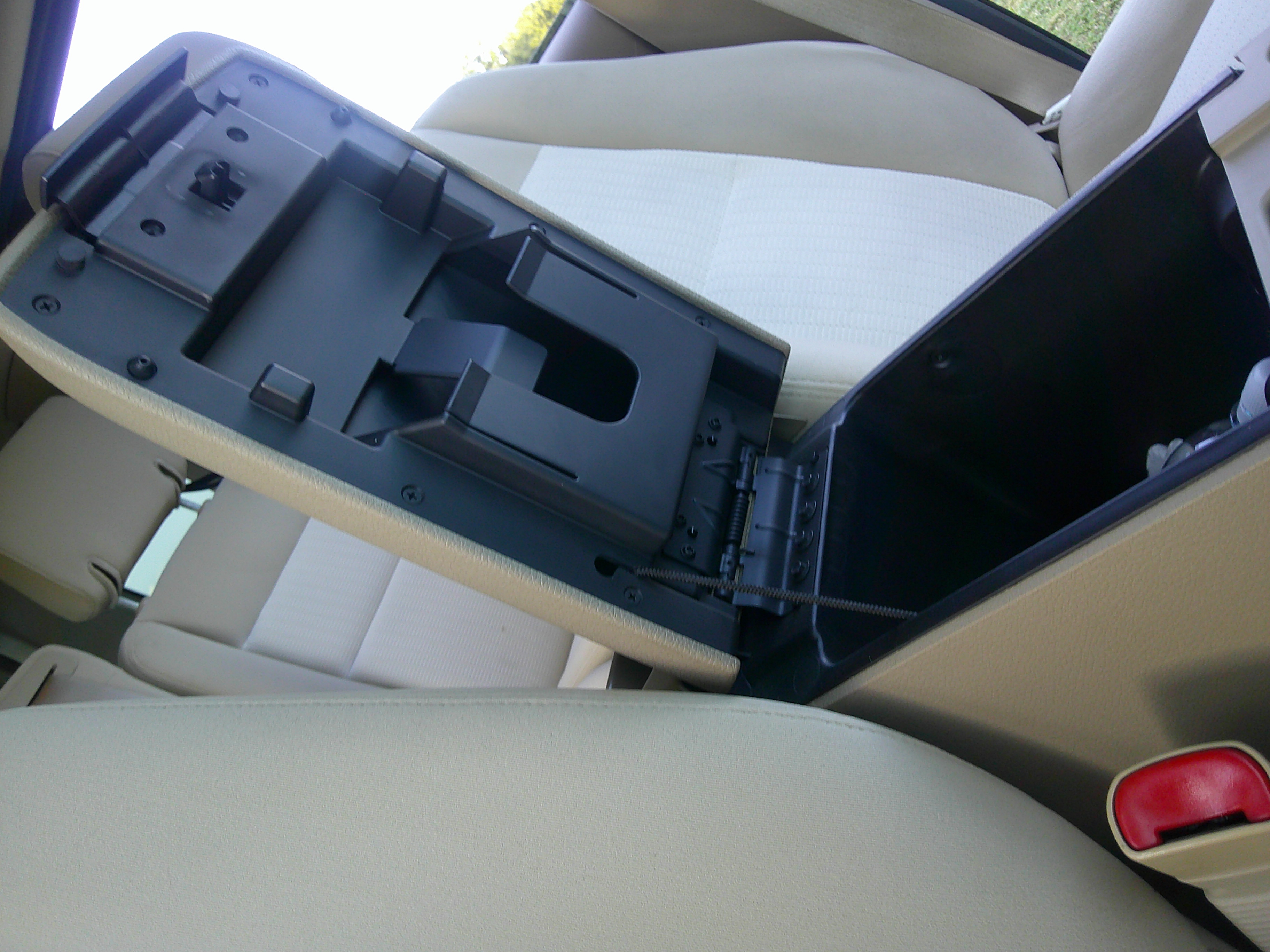 Open center console storage compartment and front seats