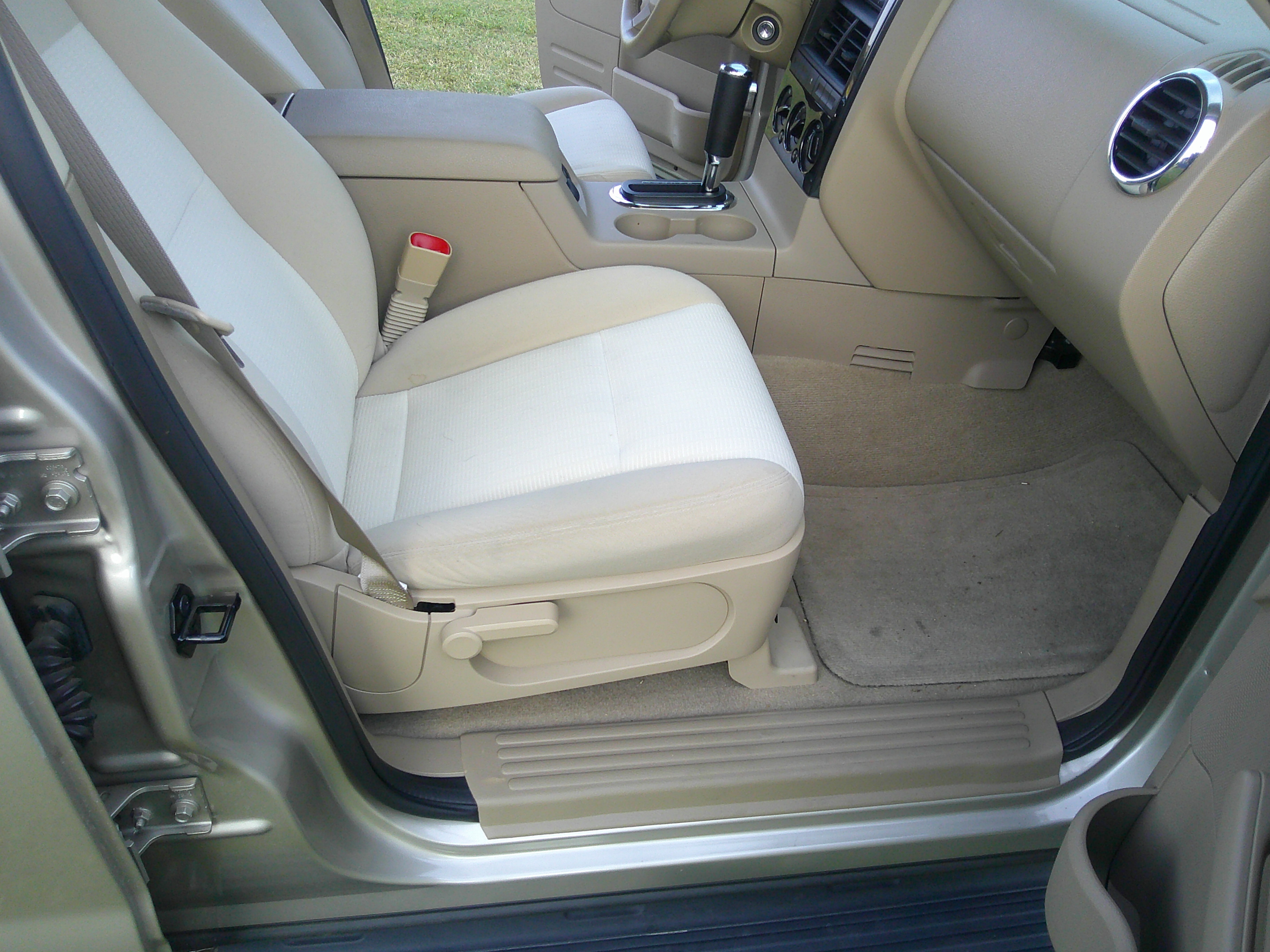 Passenger side front seat and tan interior trim