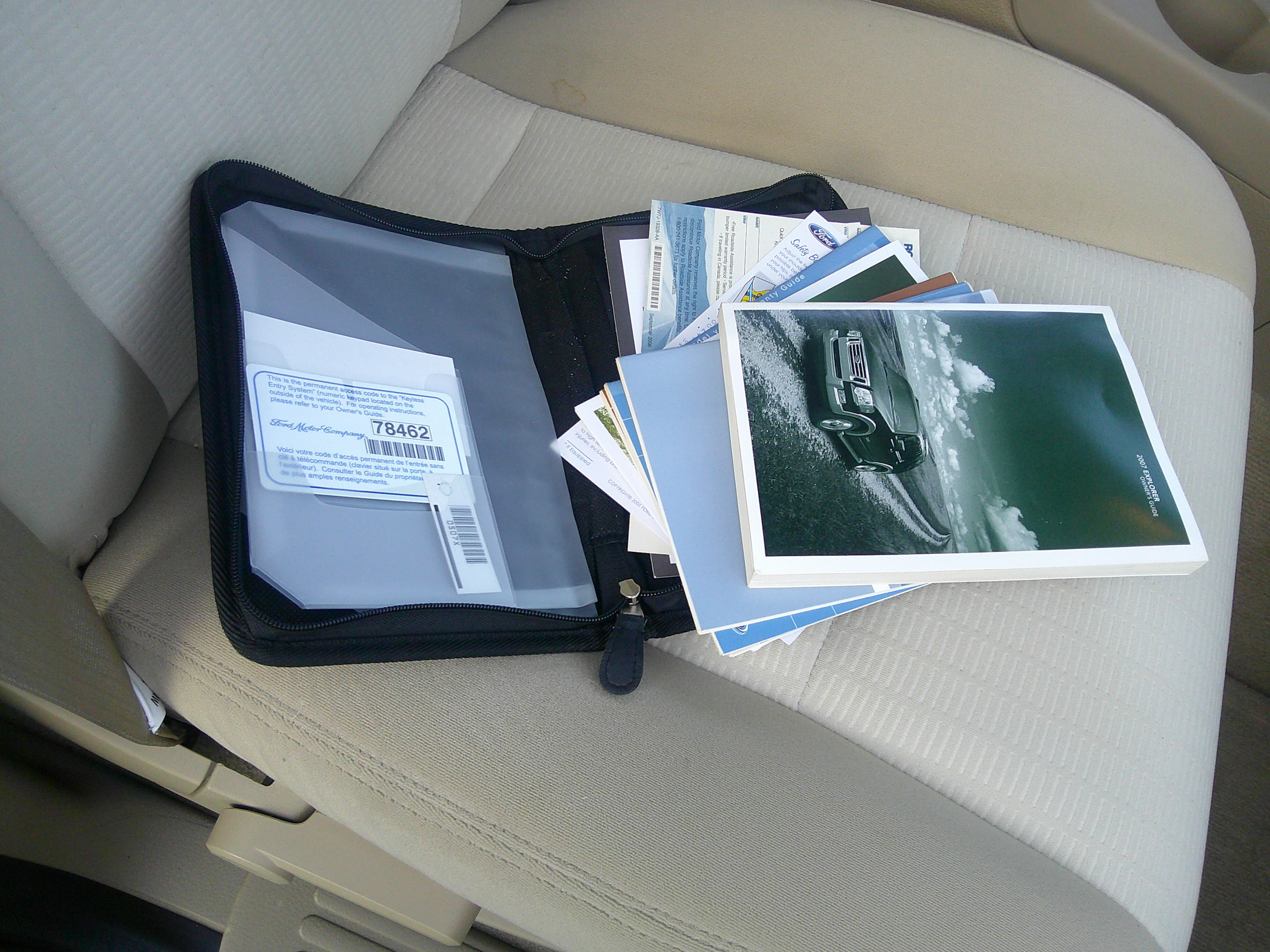 Owner's manual, literature, and keyless entry code card in original portfolio.