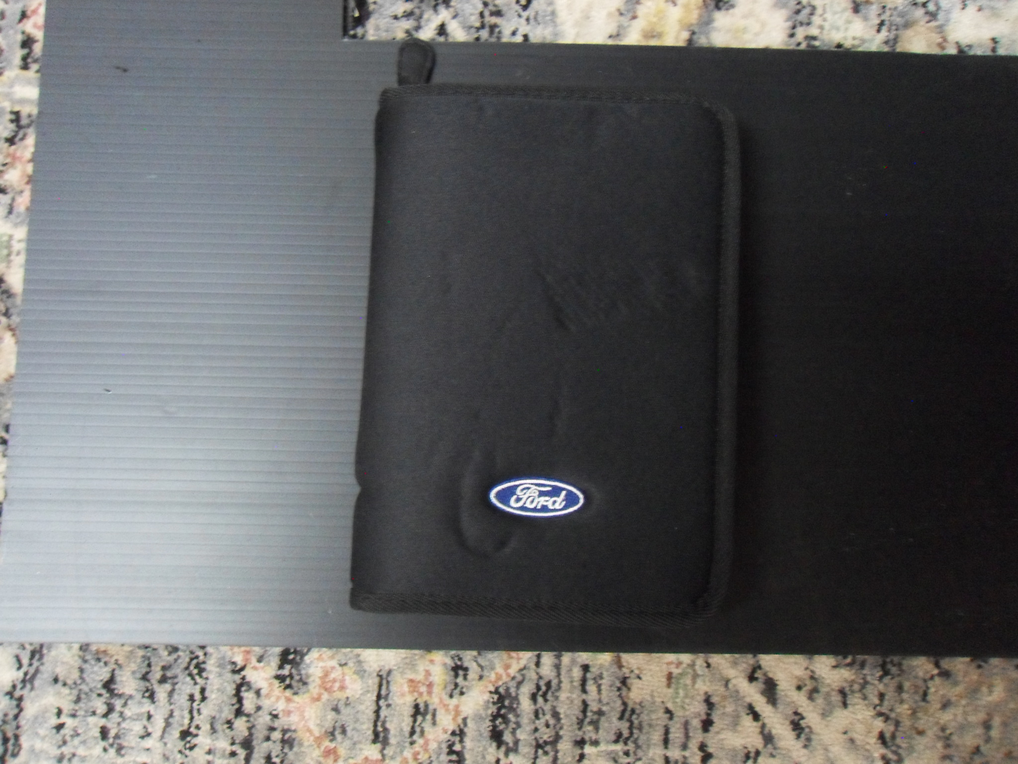 Black Ford branded zip-up owner's manual case