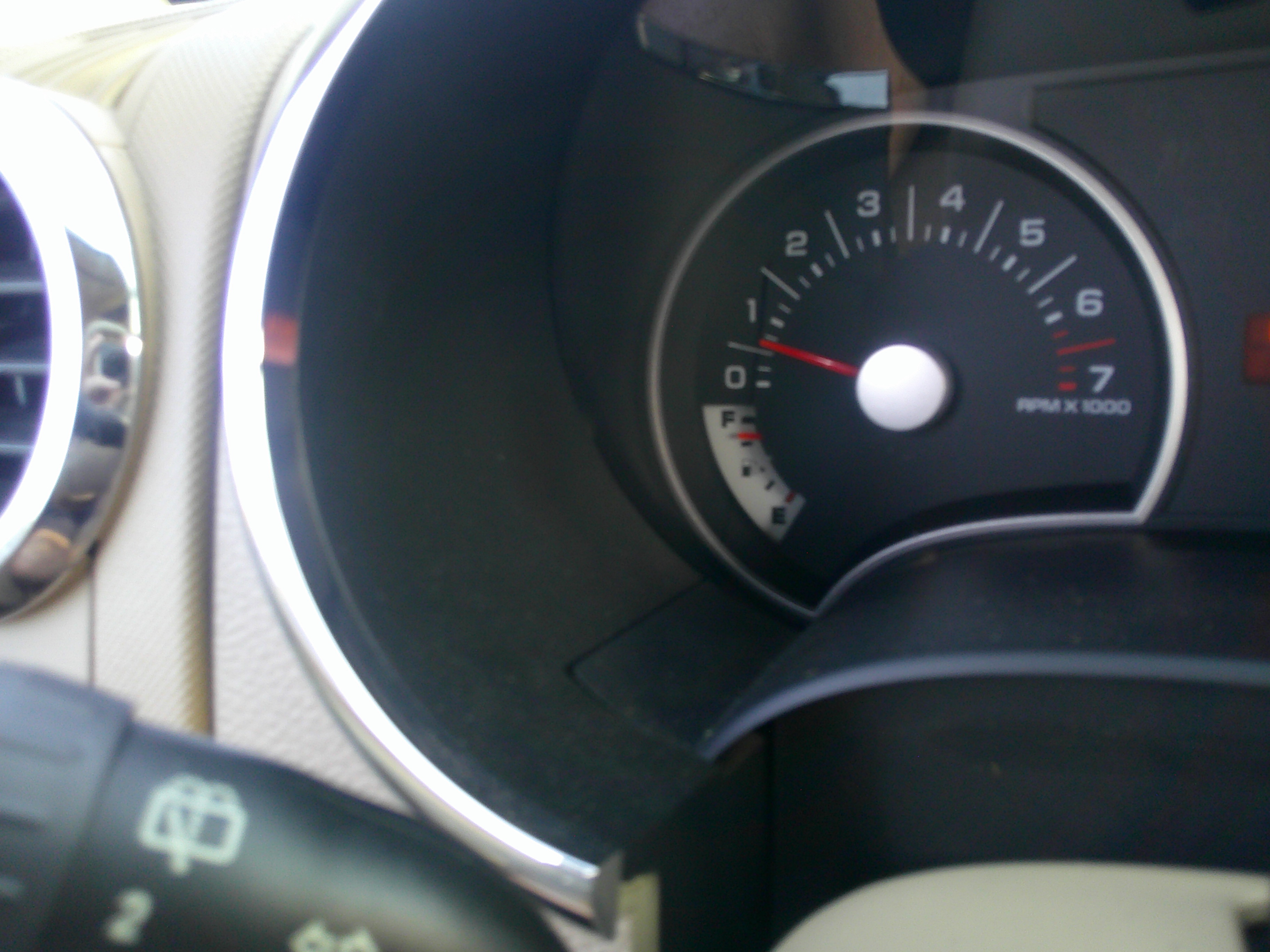 Close-up of the tachometer and fuel gauge in the instrument cluster.