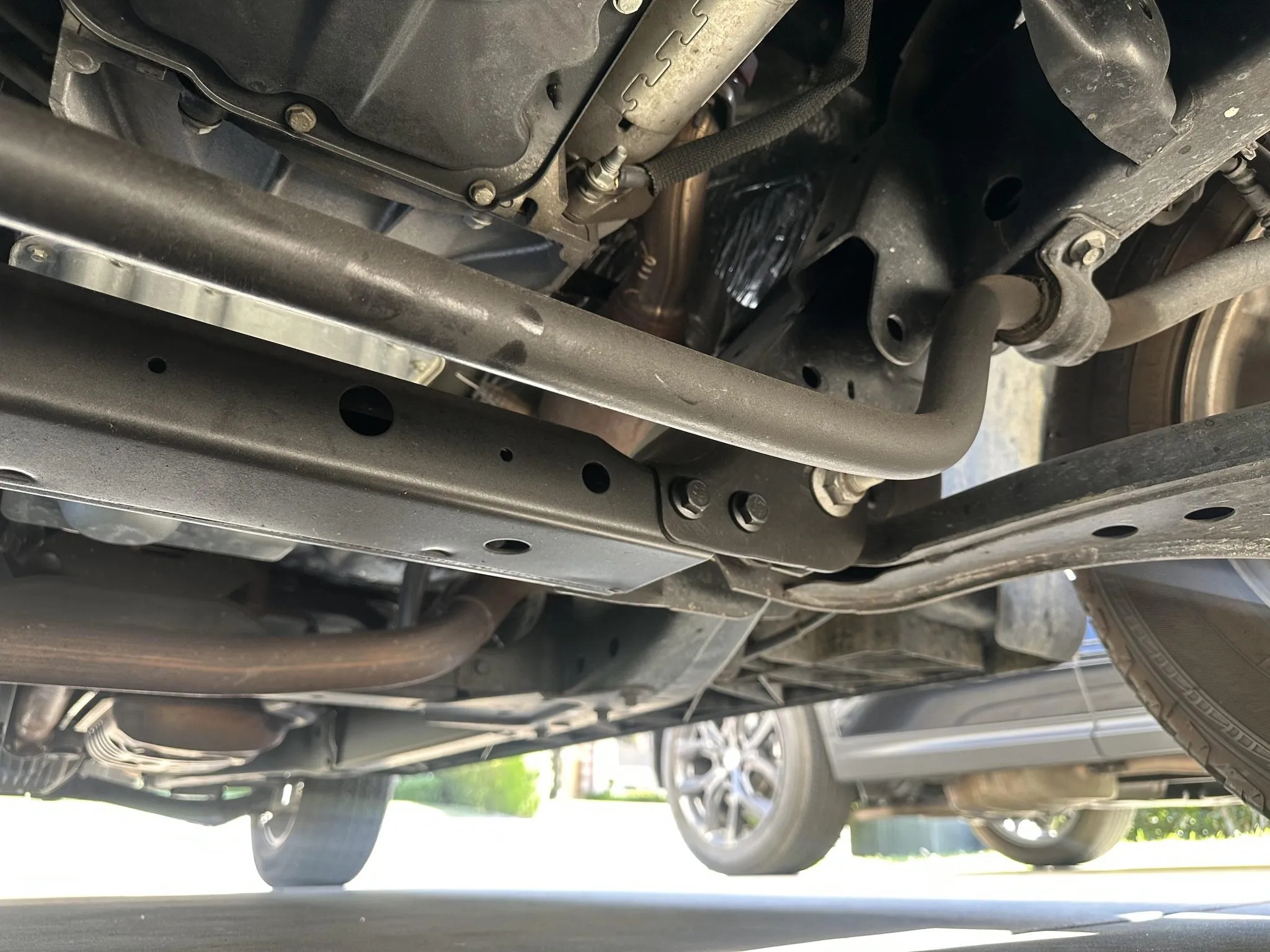 Underbody view showing chassis, sway bar, and suspension components.