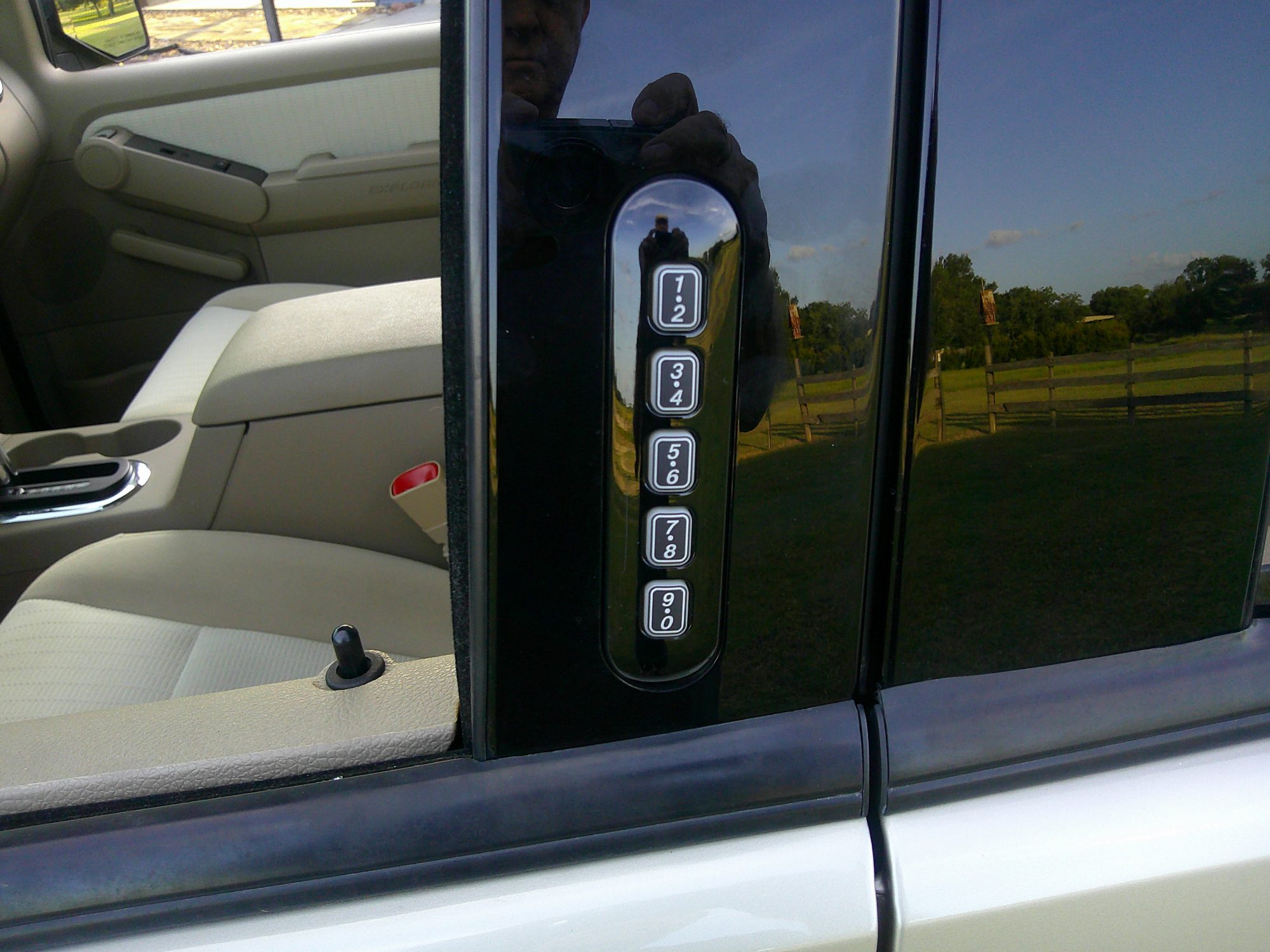 Keyless entry keypad mounted on the driver side door pillar.