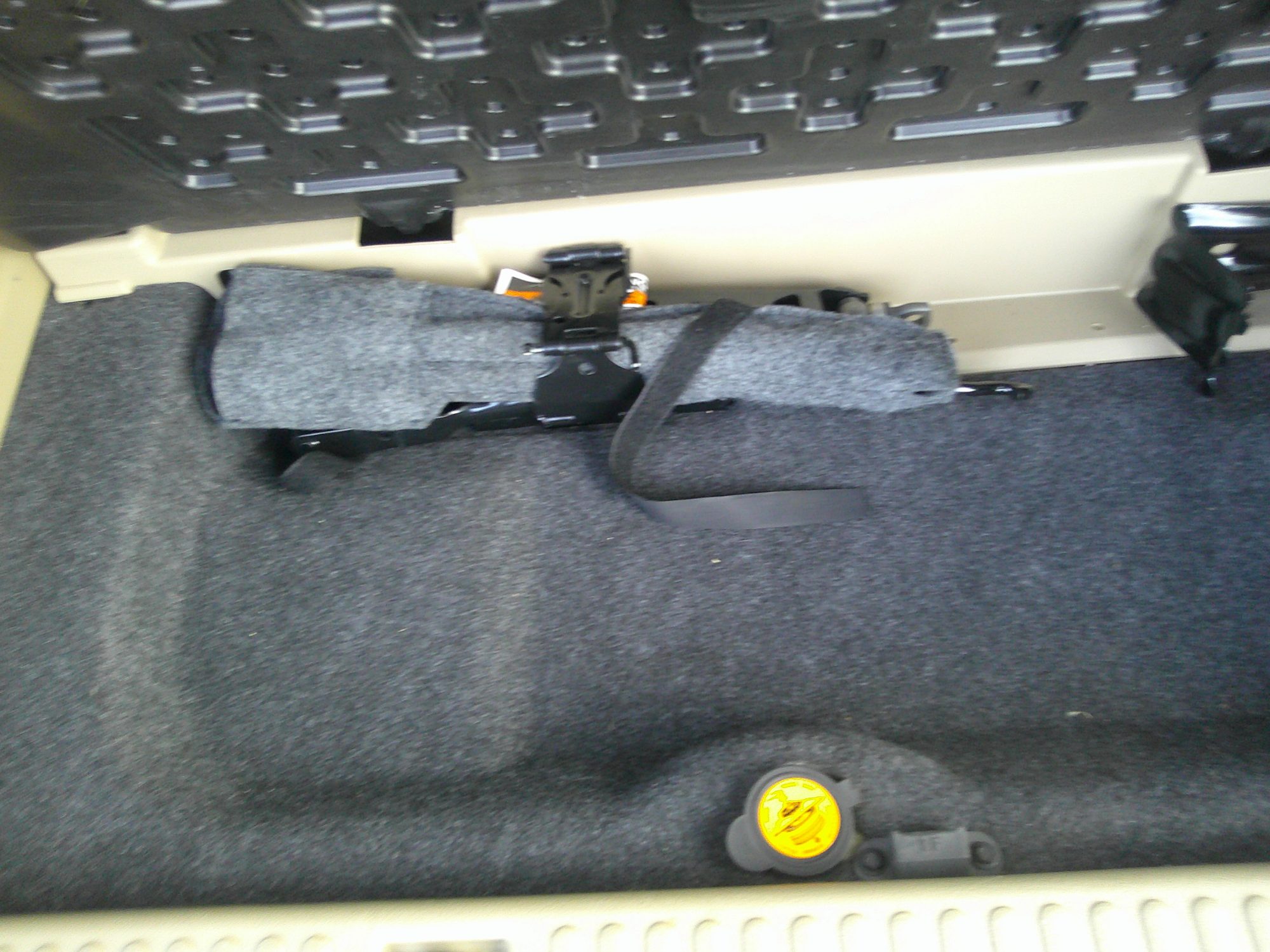 Jack and emergency tools stored in the rear compartment