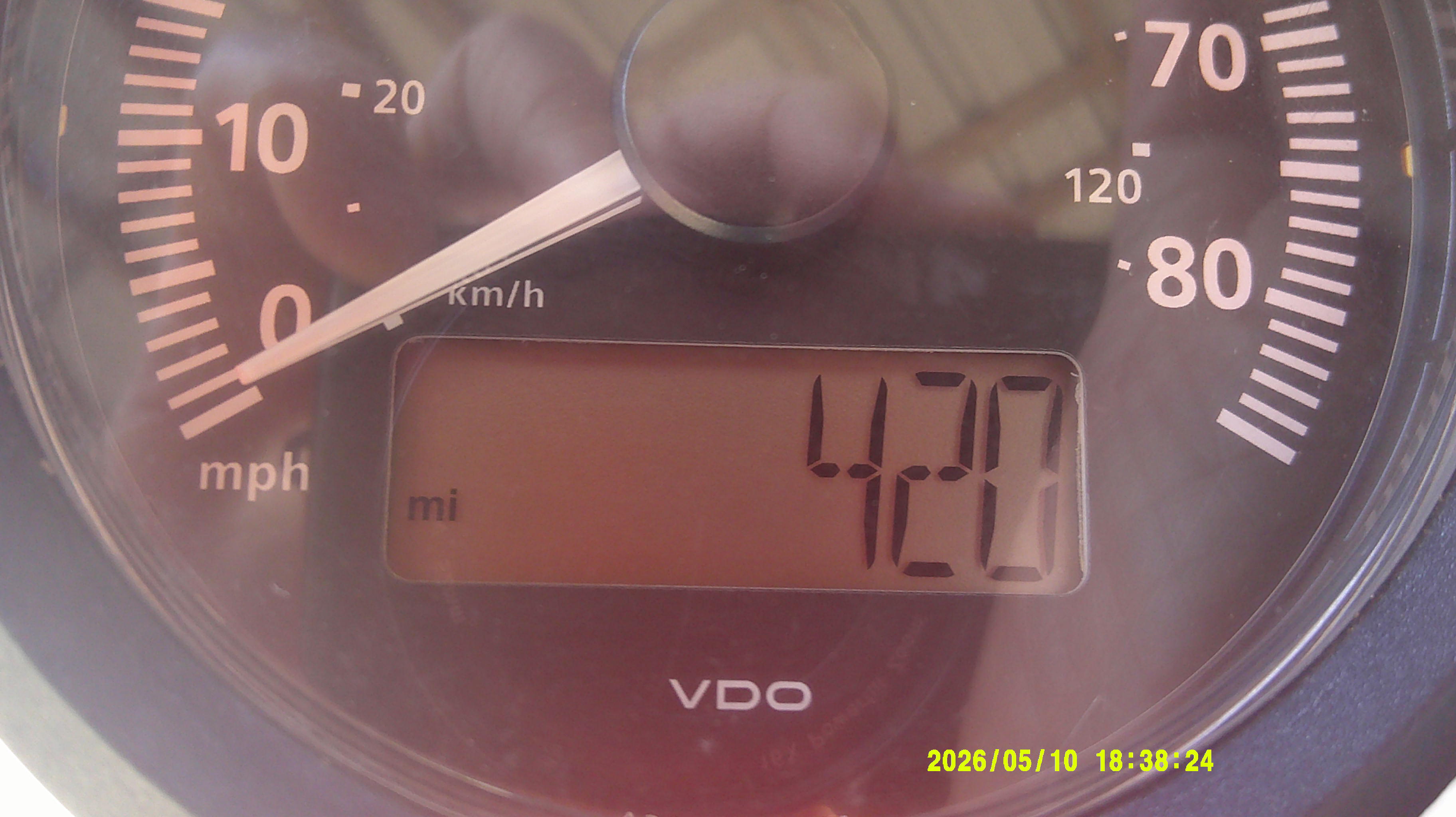 Close-up of VDO speedometer and digital odometer reading 420 miles.