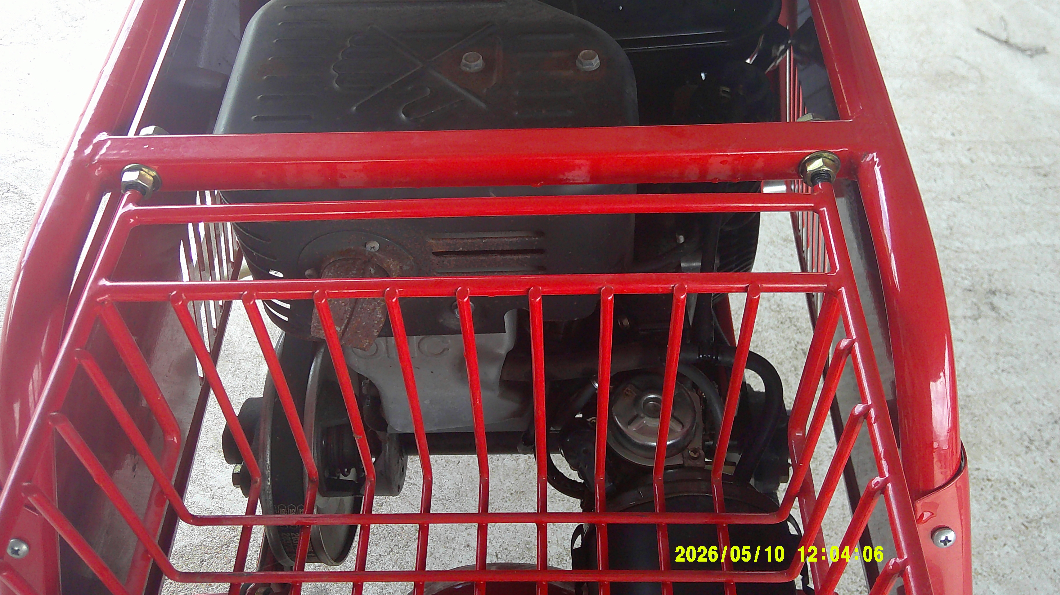 View of the engine and drivetrain components through the rear cage