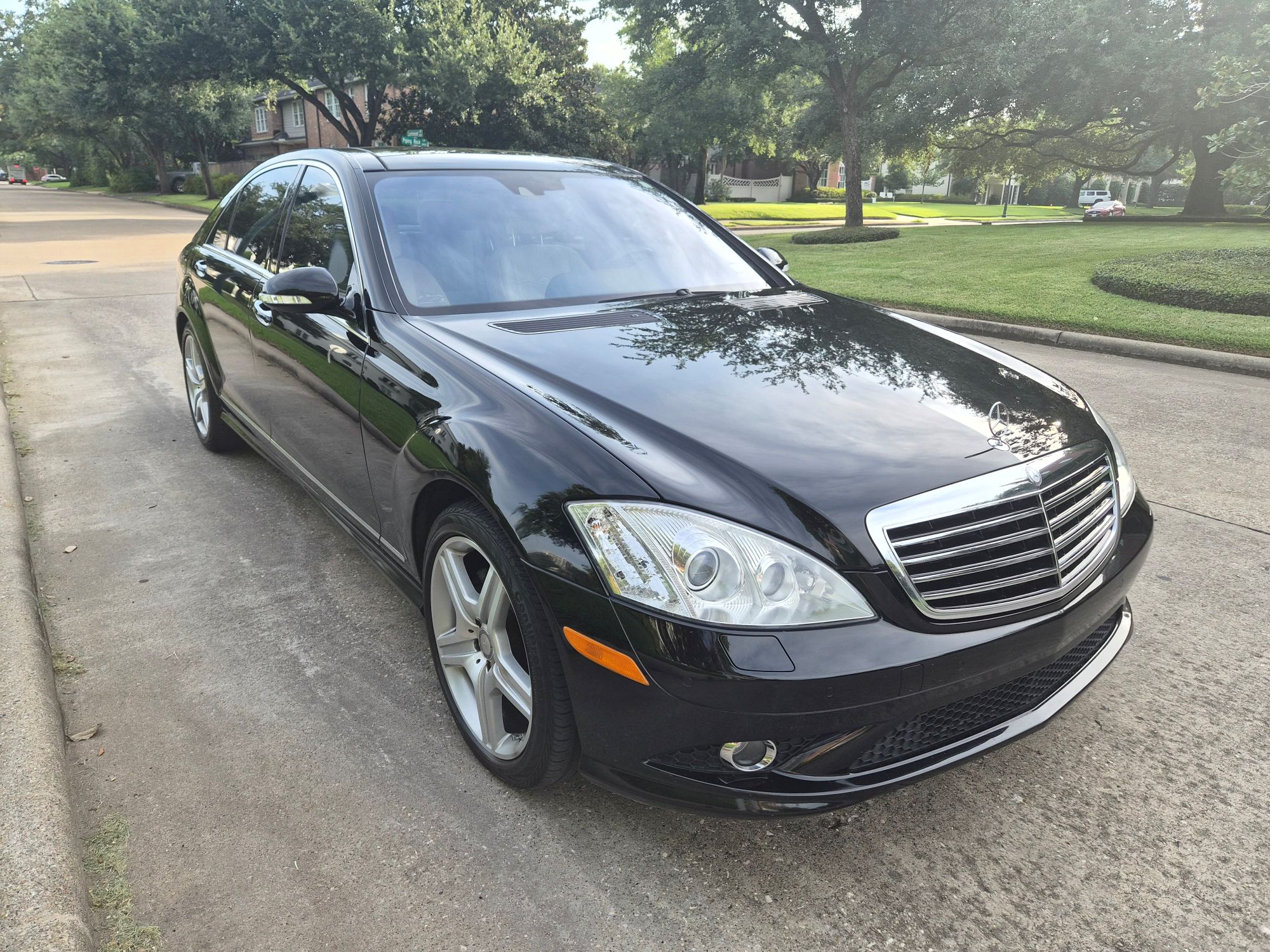 Front three-quarter view of a black Mercedes-Benz S-Class sedan.