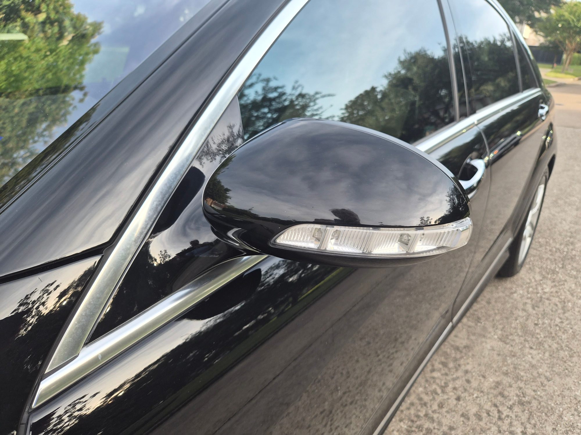 Close-up of the driver-side wing mirror with integrated turn signal.