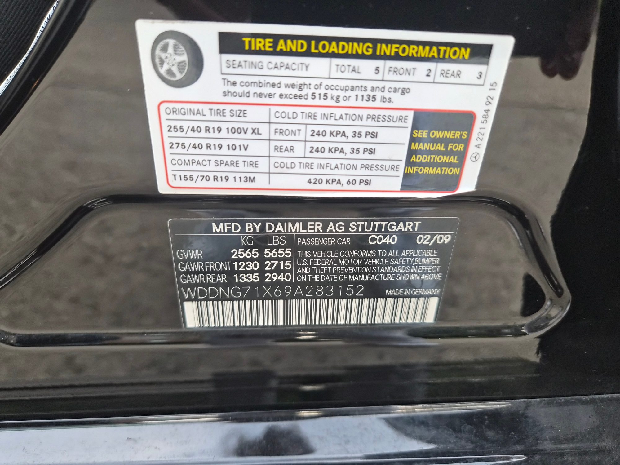 Vehicle identification number and tire information stickers on door jamb.
