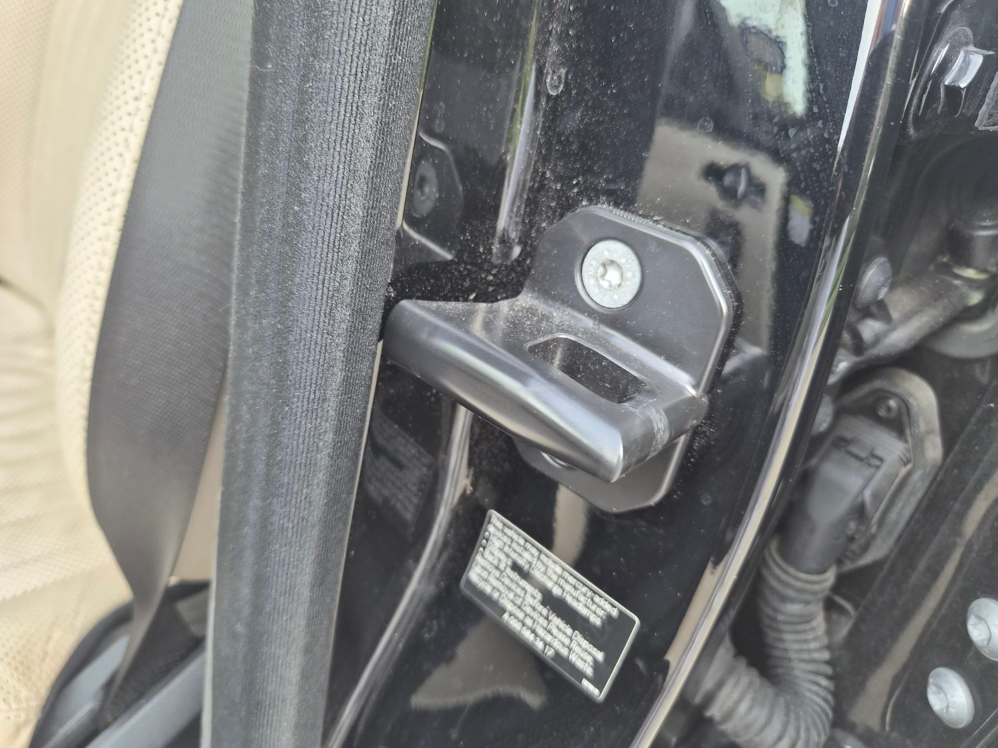 Close-up of the door striker and jamb assembly