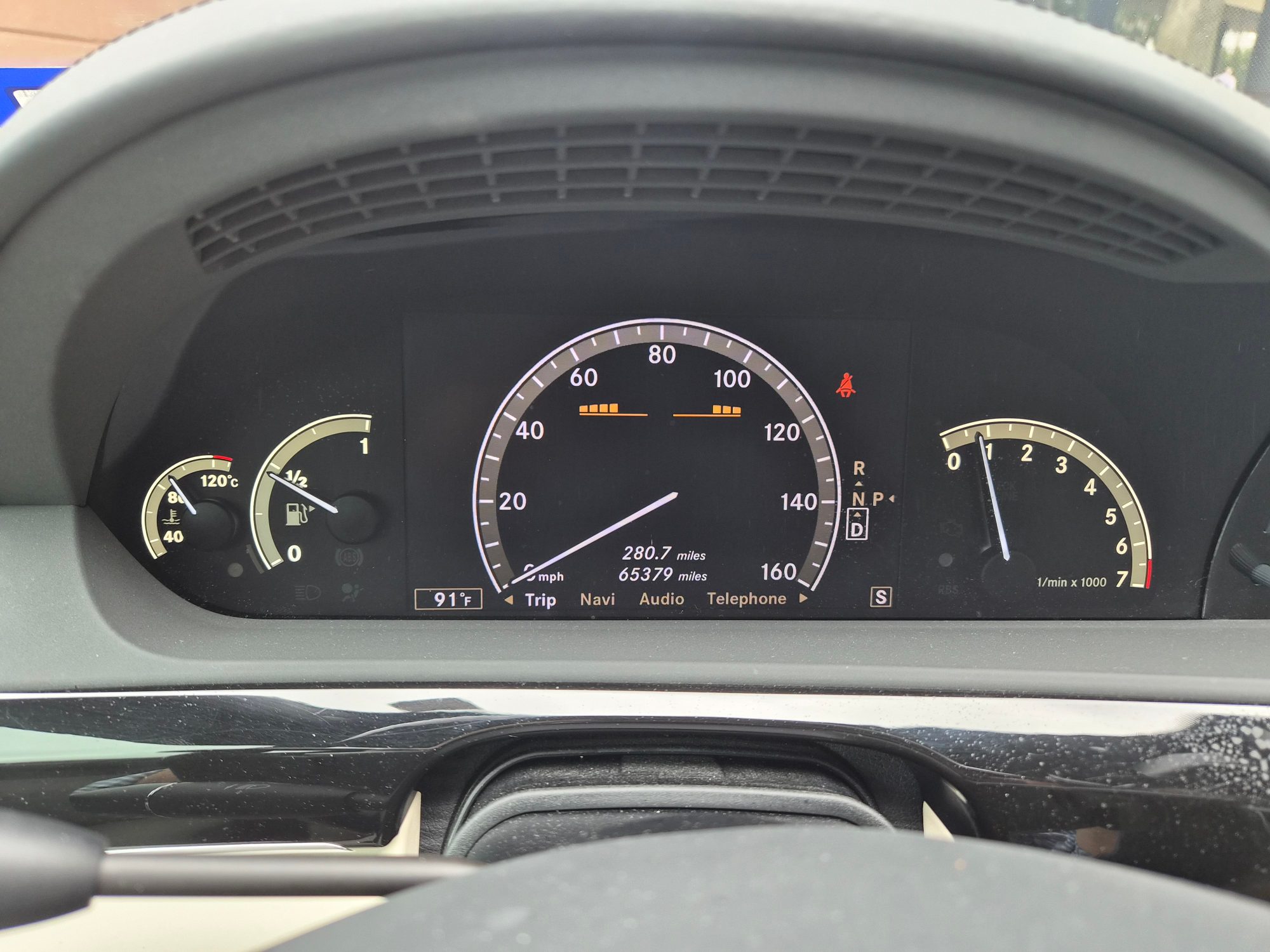 Instrument cluster showing speedometer, tachometer, and odometer reading 65,379 miles.