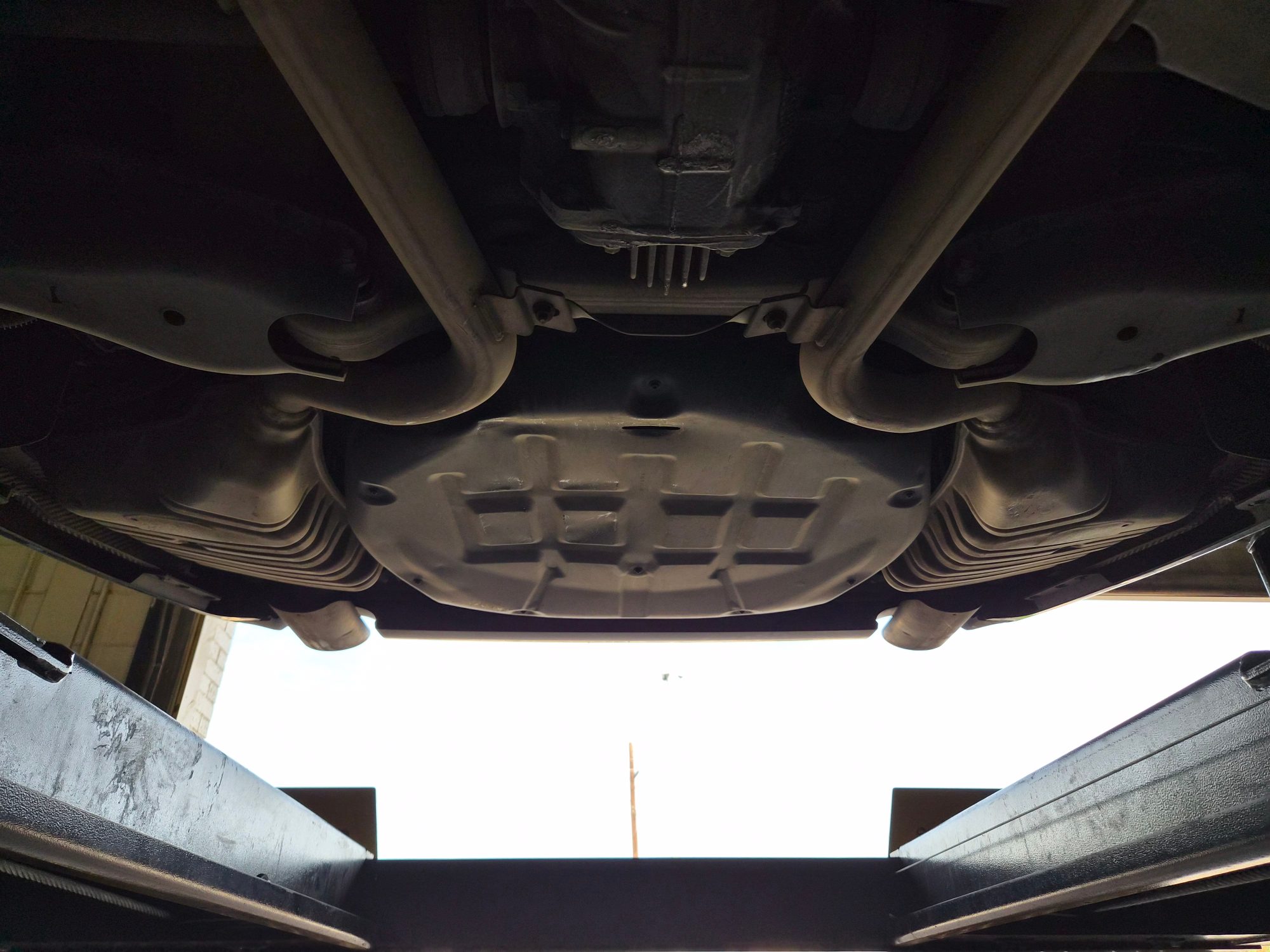 Underside view showing exhaust system and rear differential