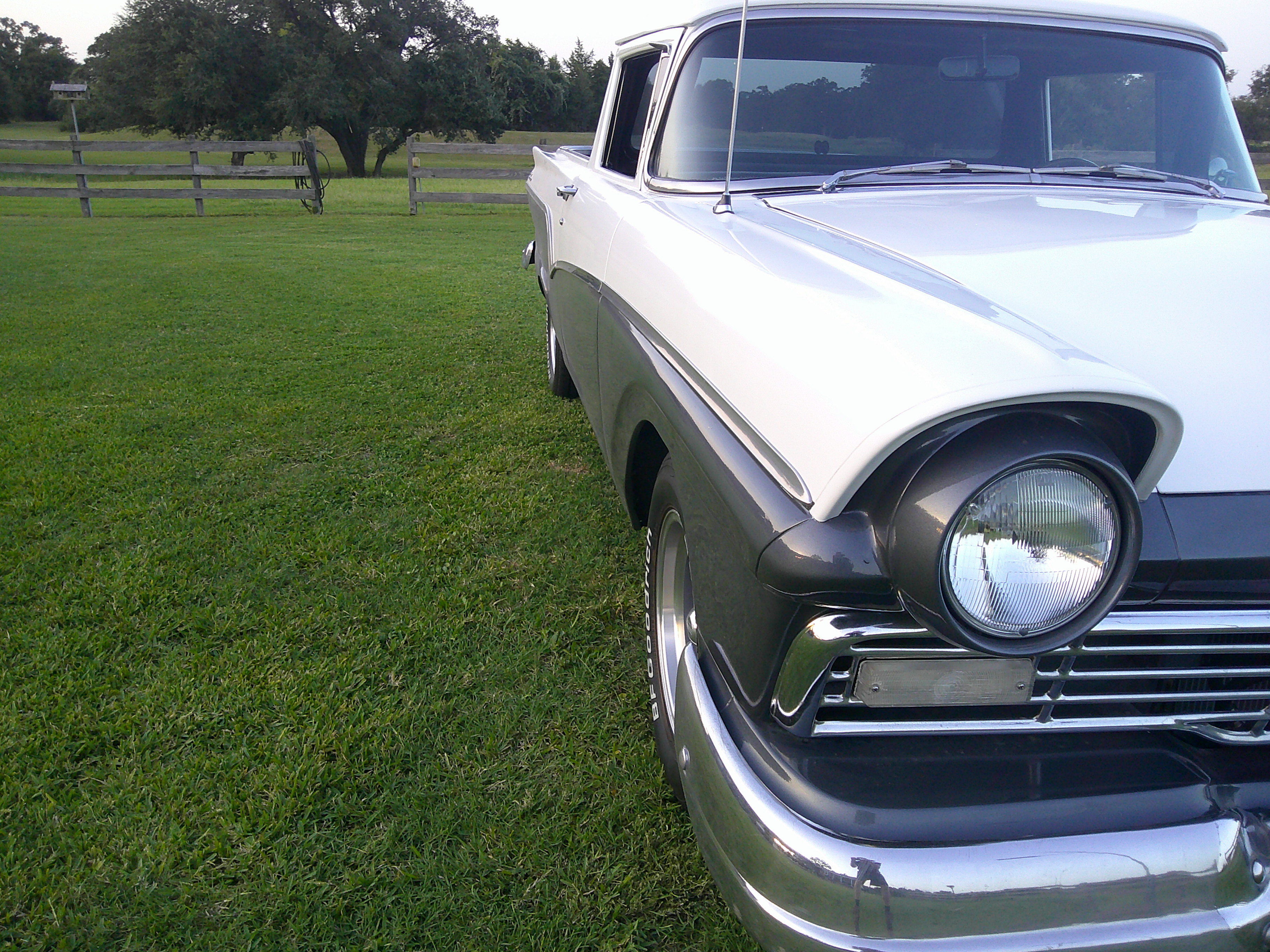 Front three-quarter view of the passenger side and headlight assembly.