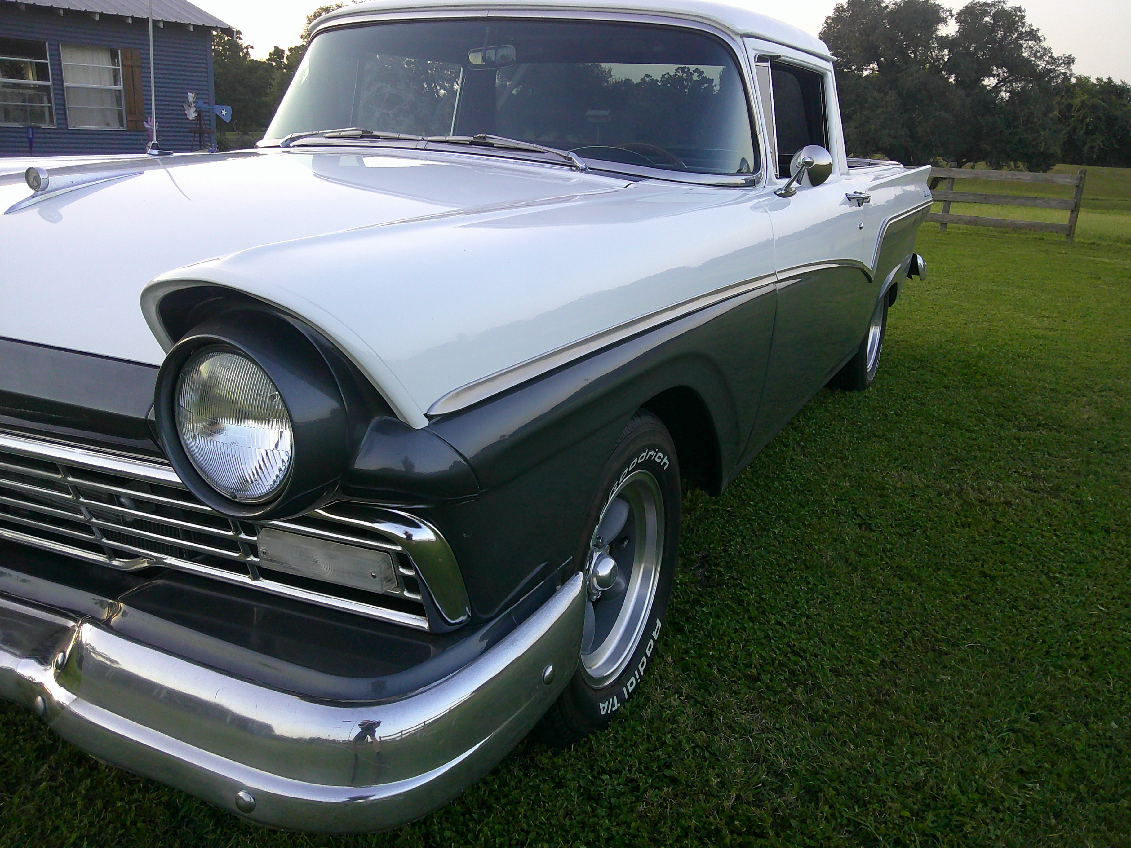 Three-quarter front view of a two-tone 1957 Ford Ranchero.