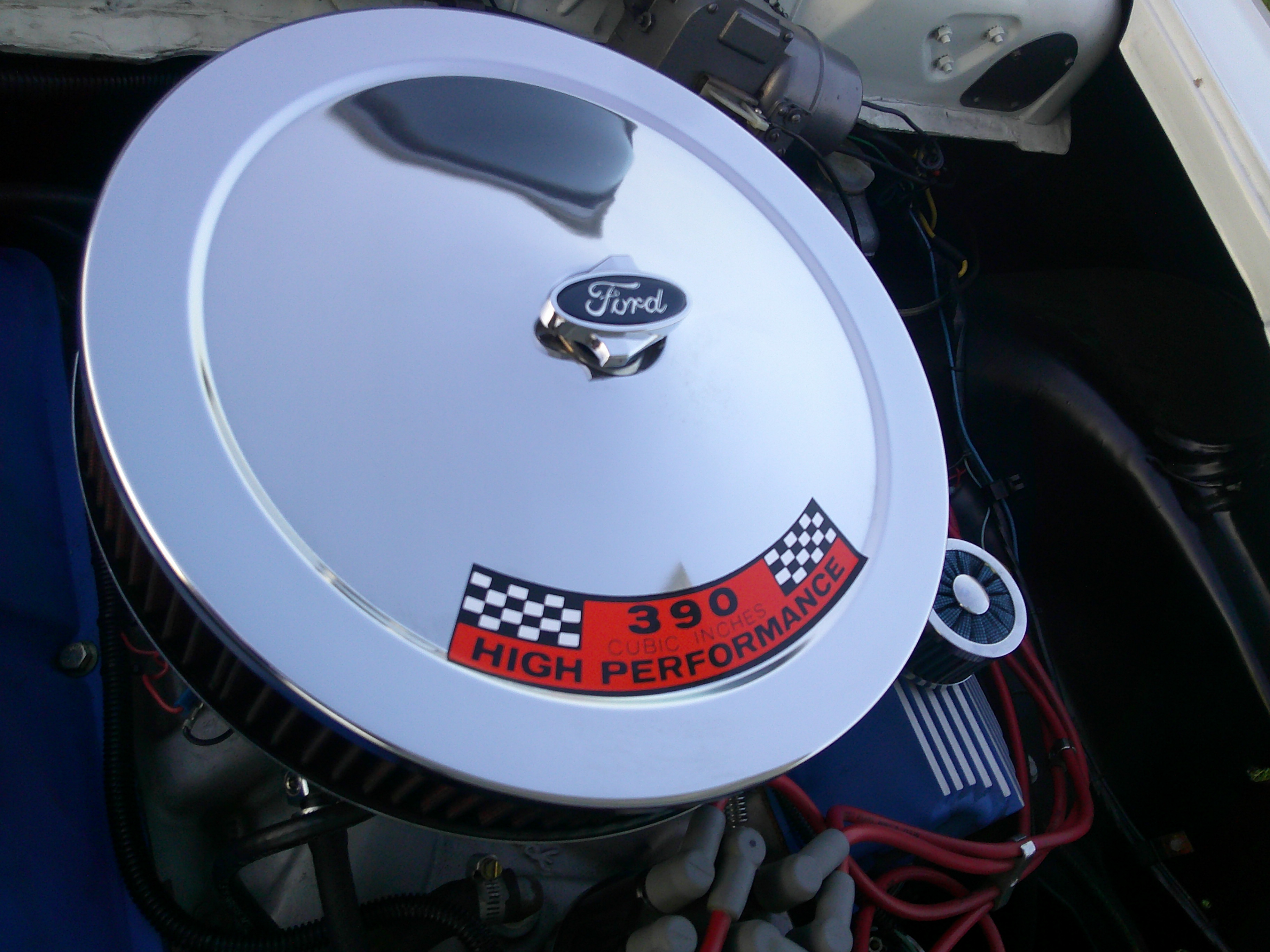 Chrome air cleaner lid on a Ford 390 High Performance V8 engine.