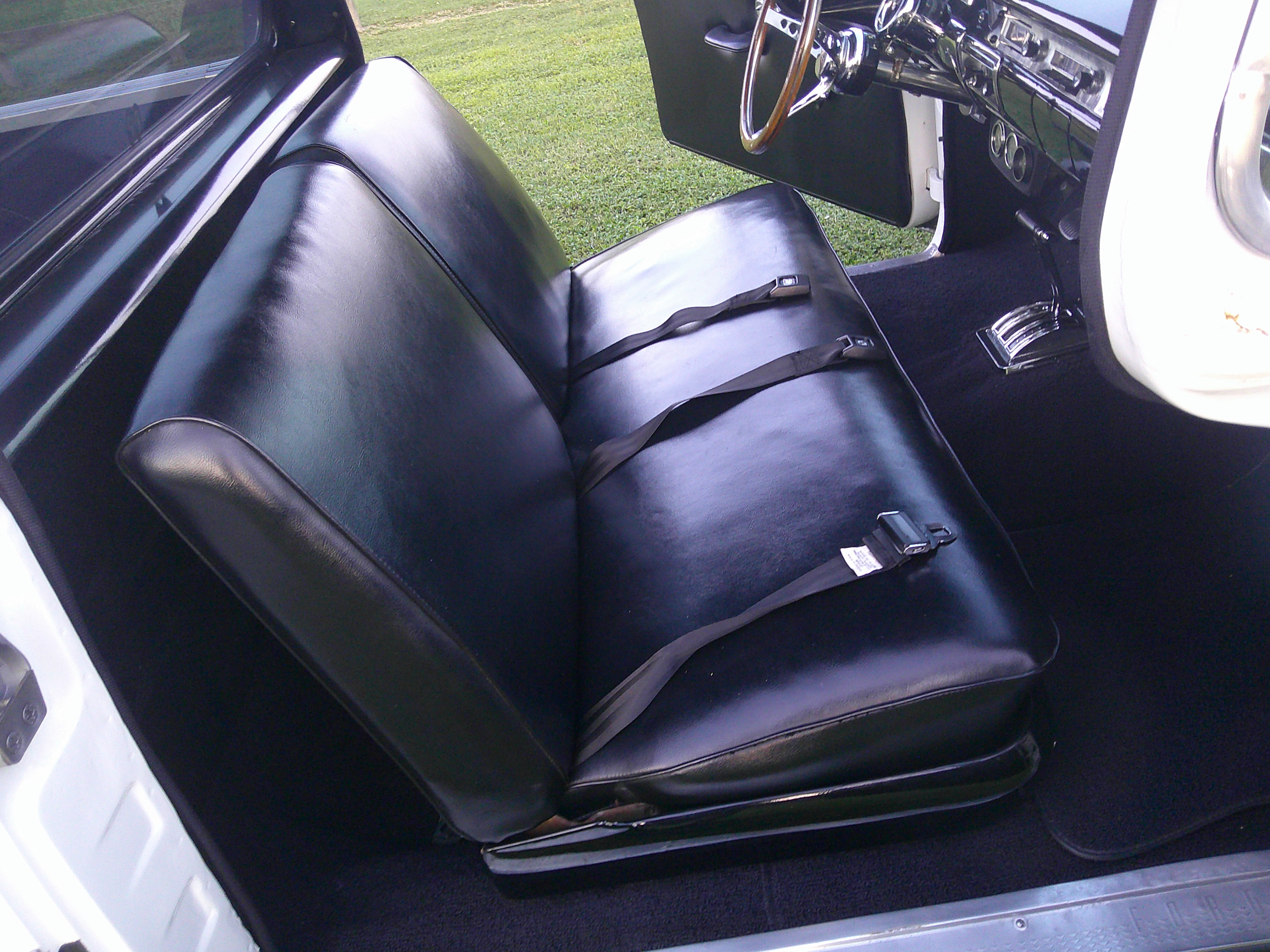 Black vinyl bench seat with lap belts