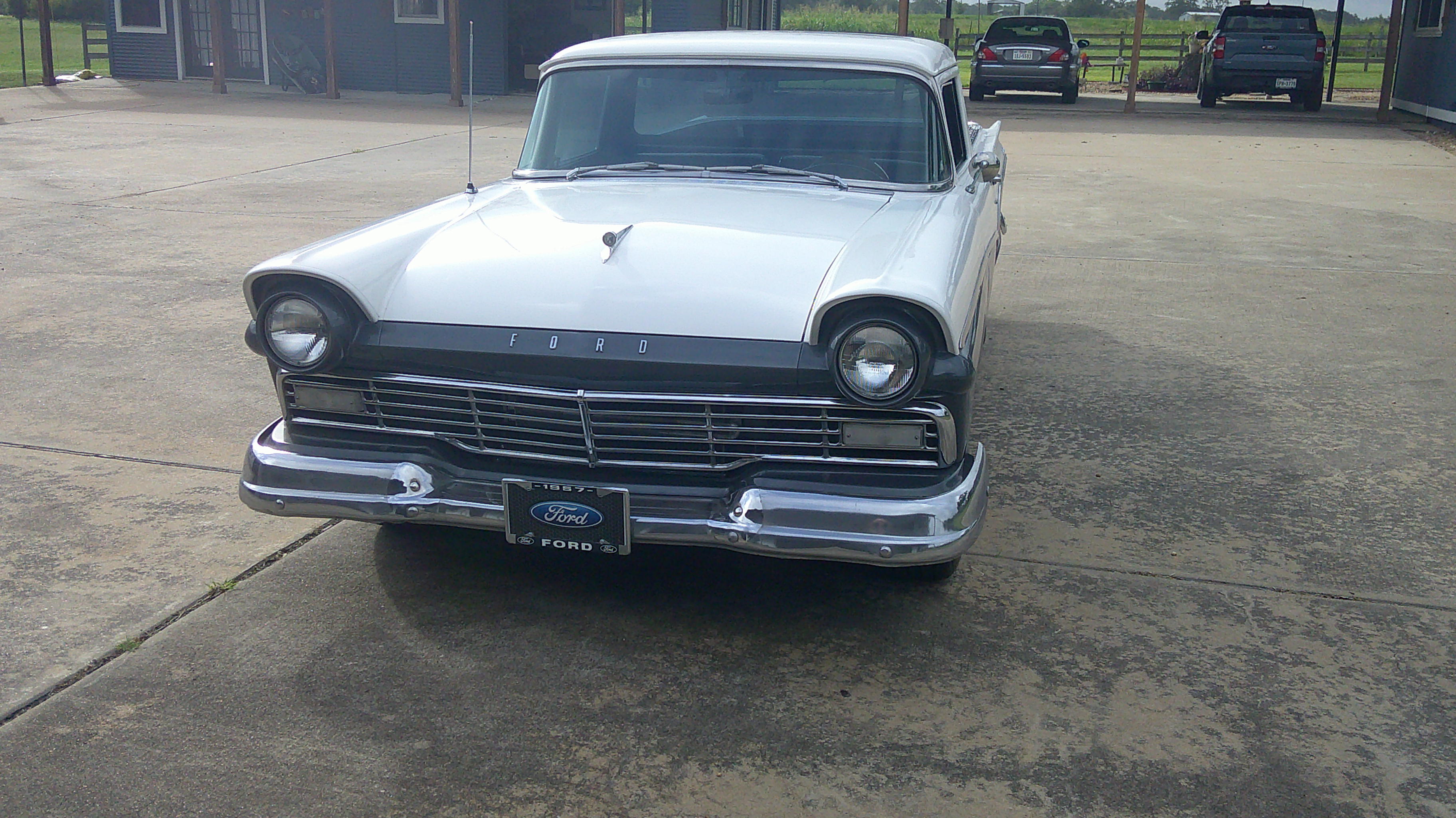 Front view of a 1957 white Ford Ranchero