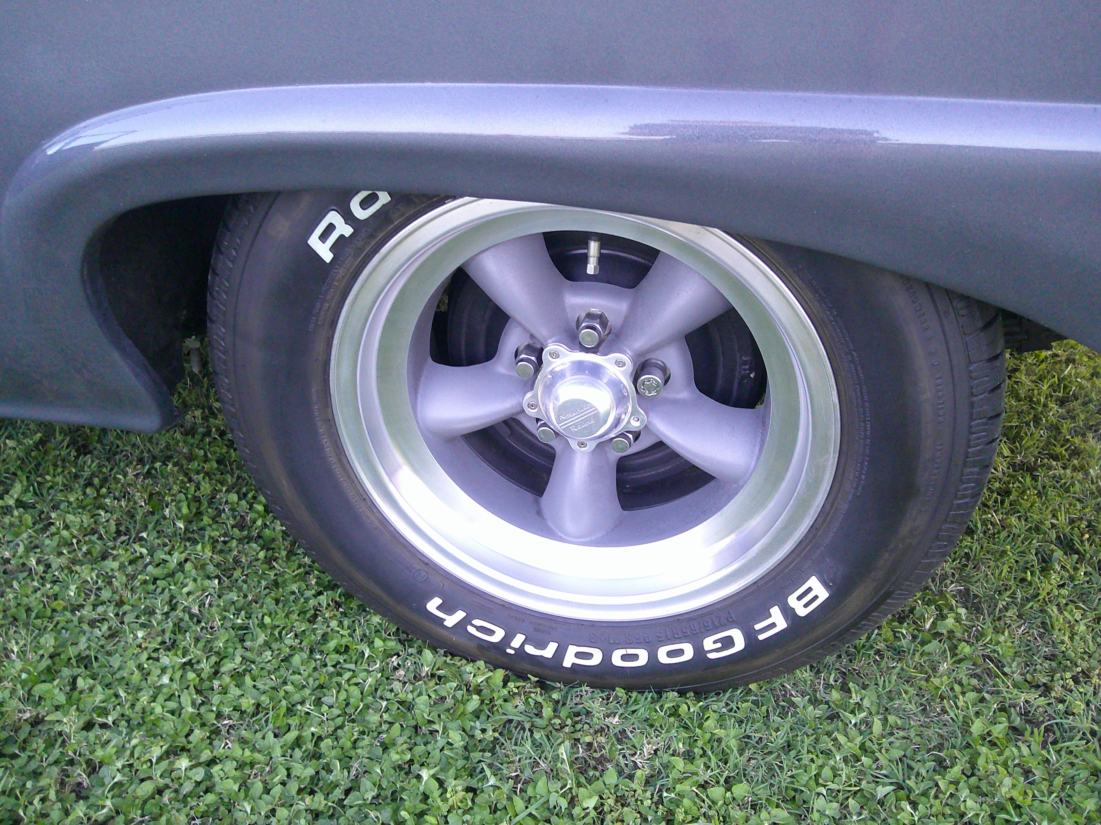 Rear wheel and tire detail on grey body