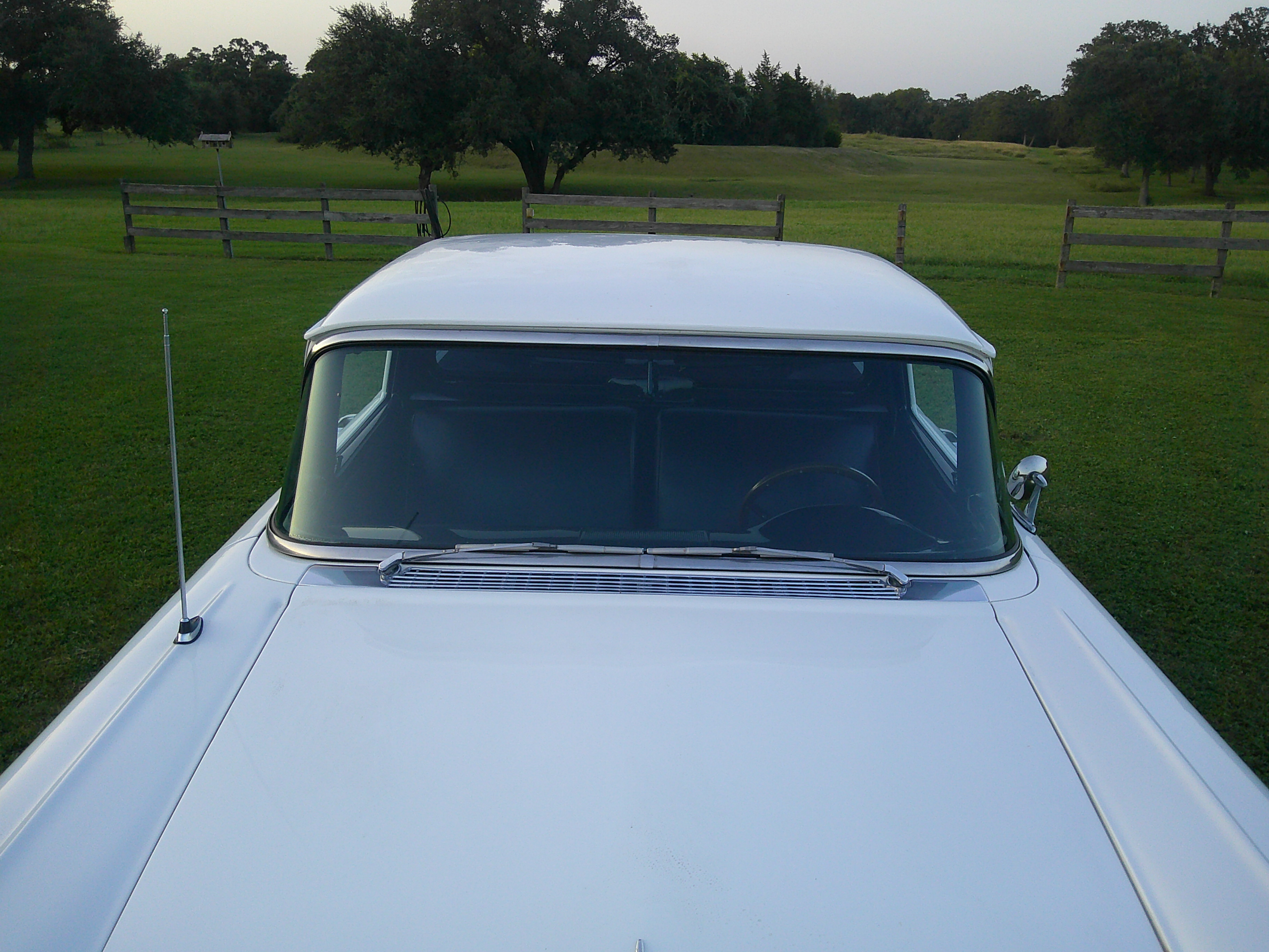 View of the front windshield, roof, and hood from a high angle.