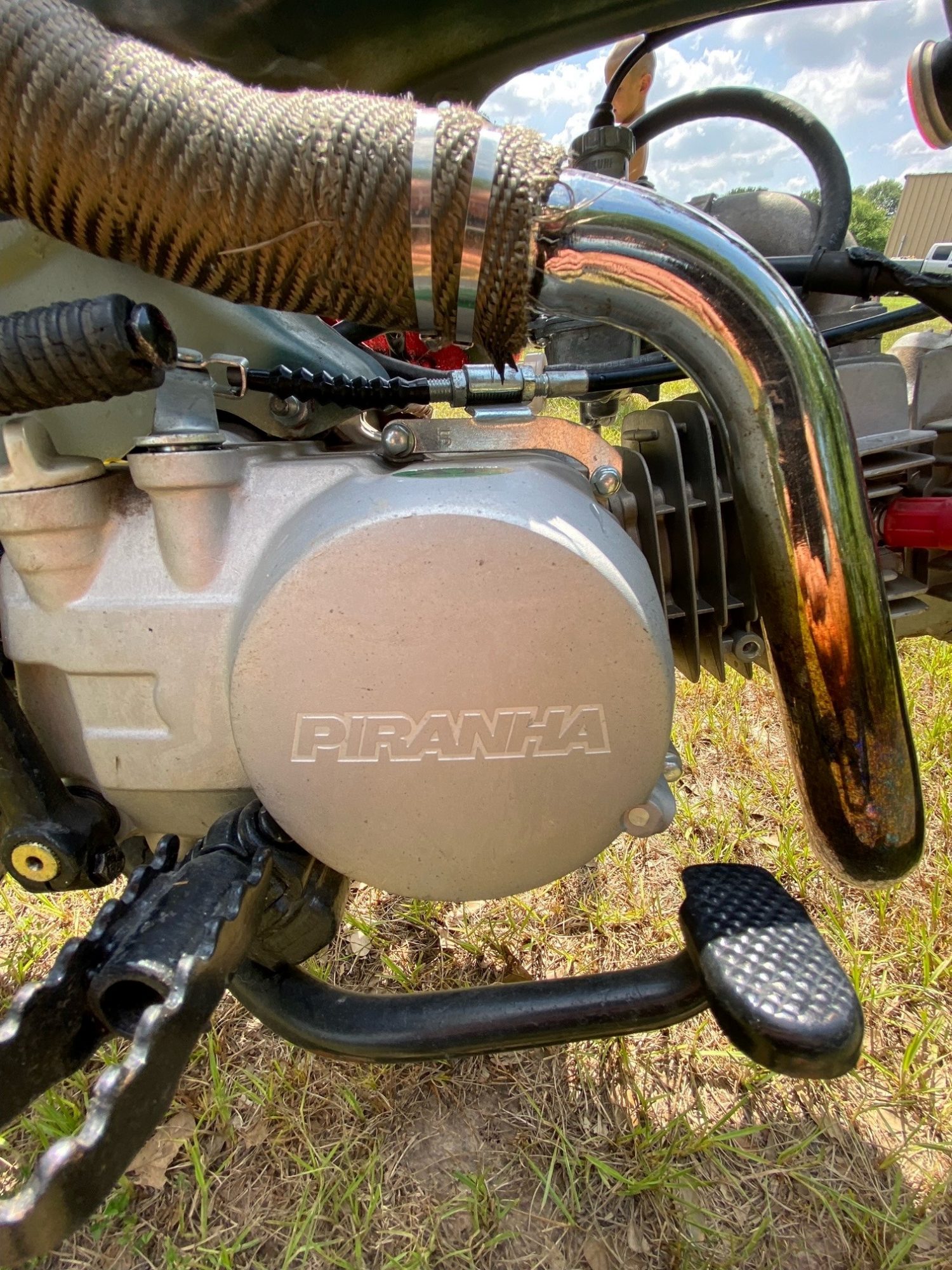 Piranha brand engine casing and exhaust pipe assembly.