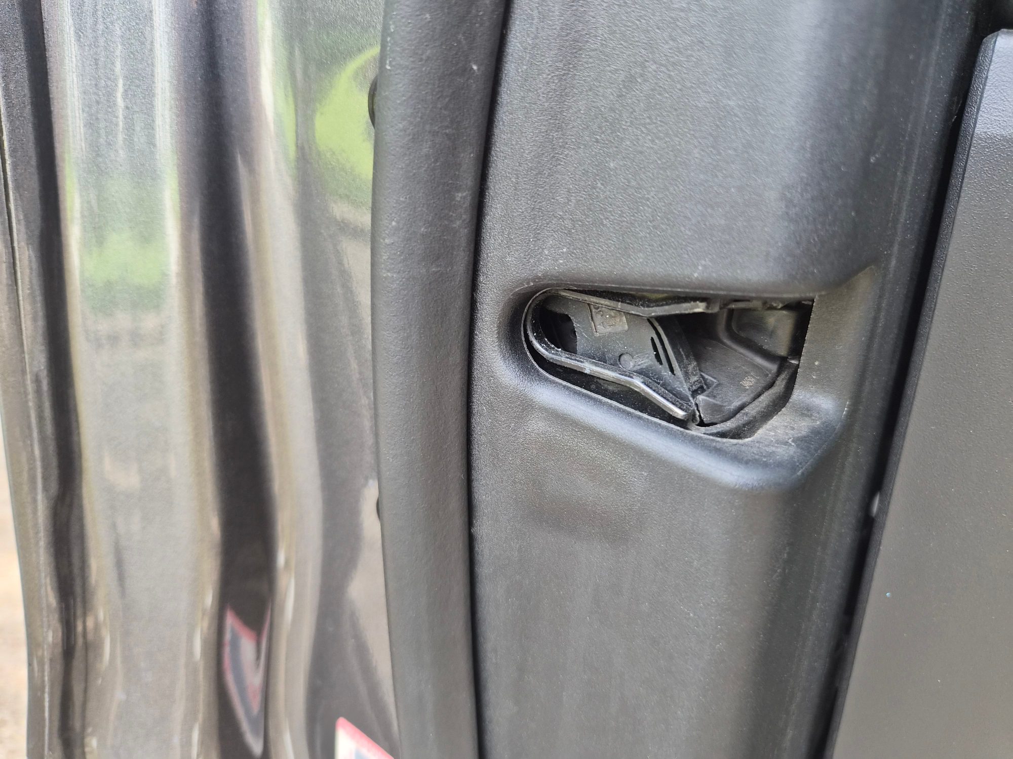 Close-up of damaged or missing trim piece on door jamb.