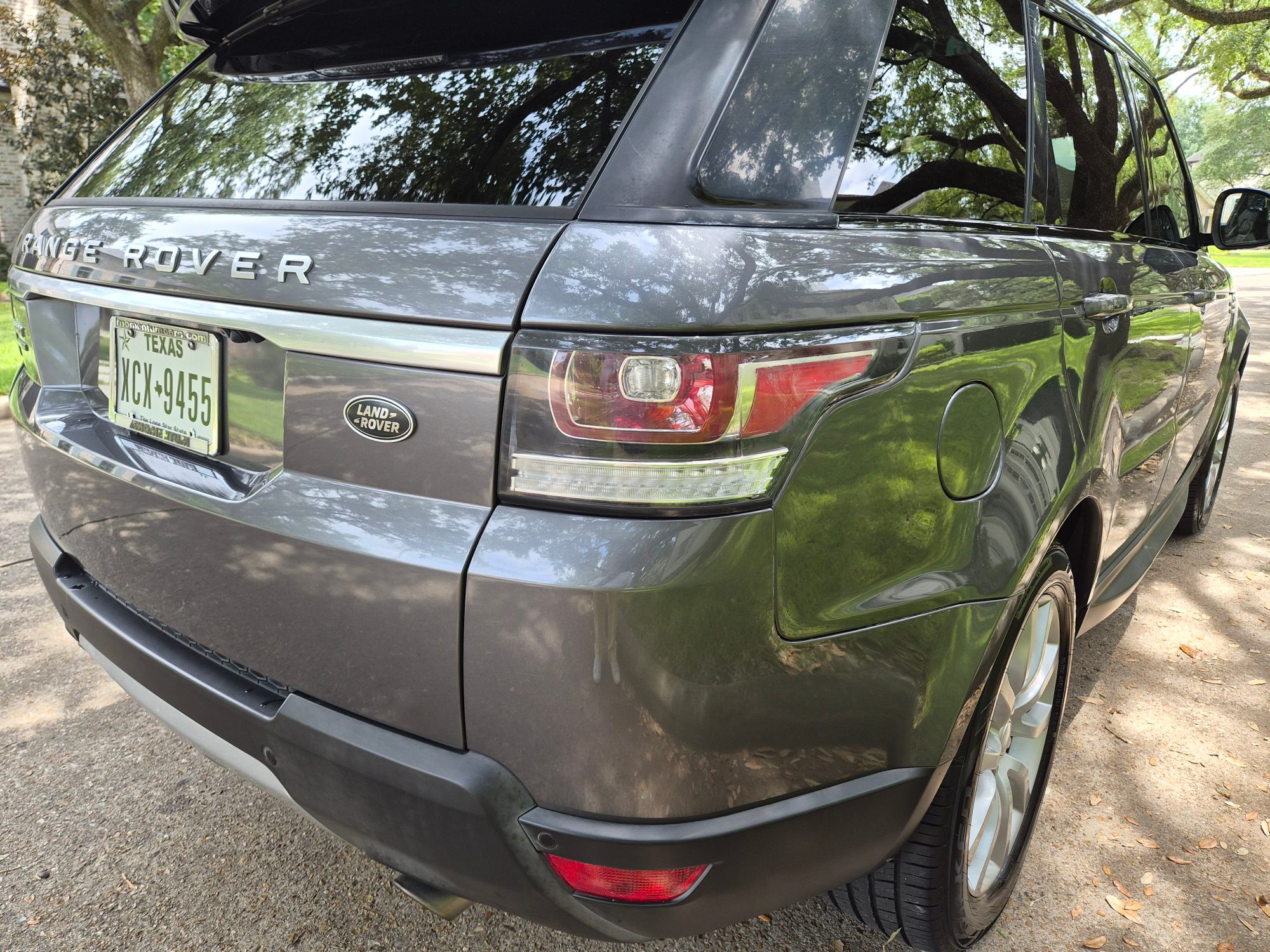 Rear three-quarter view showing the taillight, badges, and fuel door.