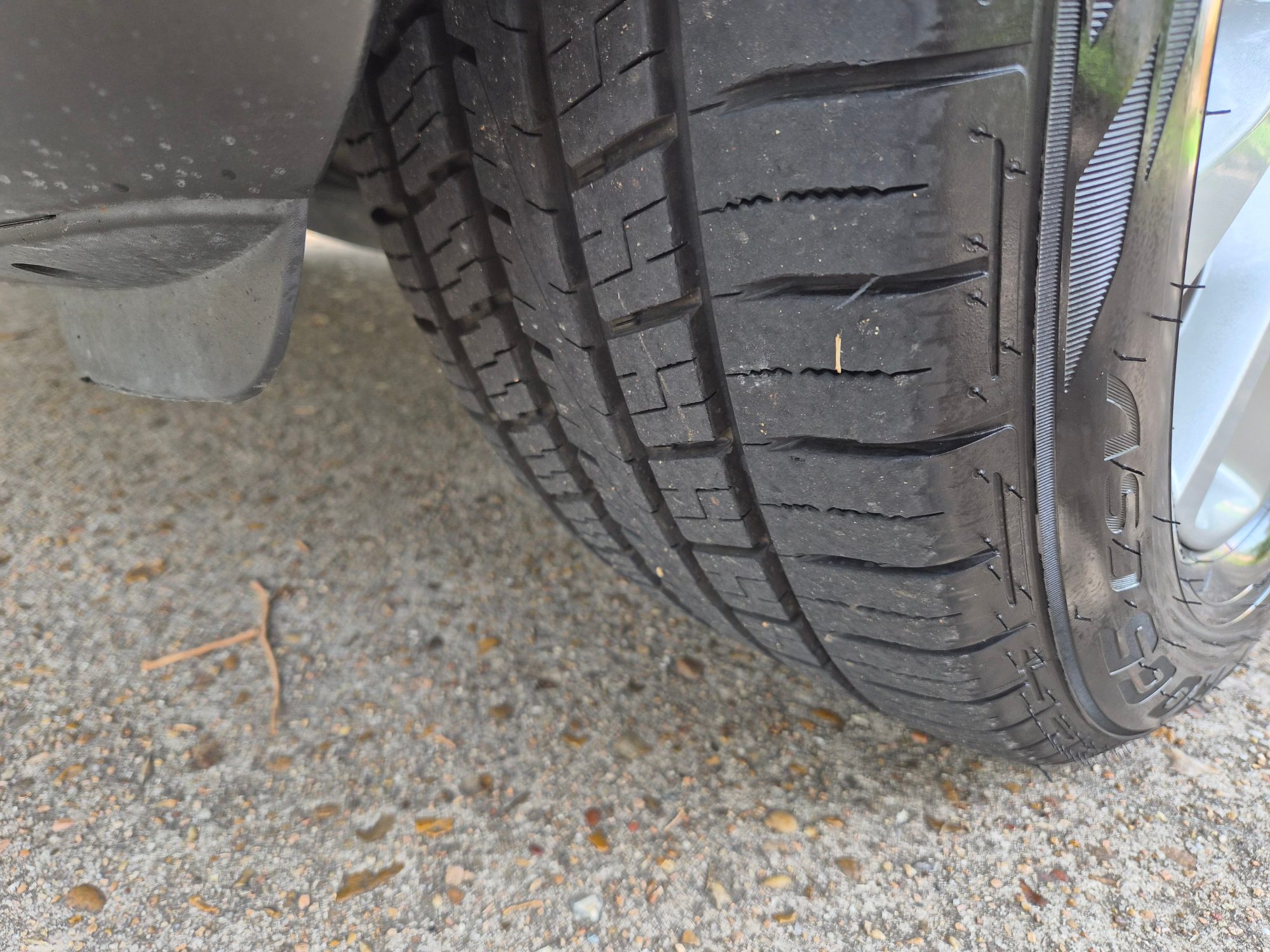 Close-up of tire tread showing wear and surface condition.