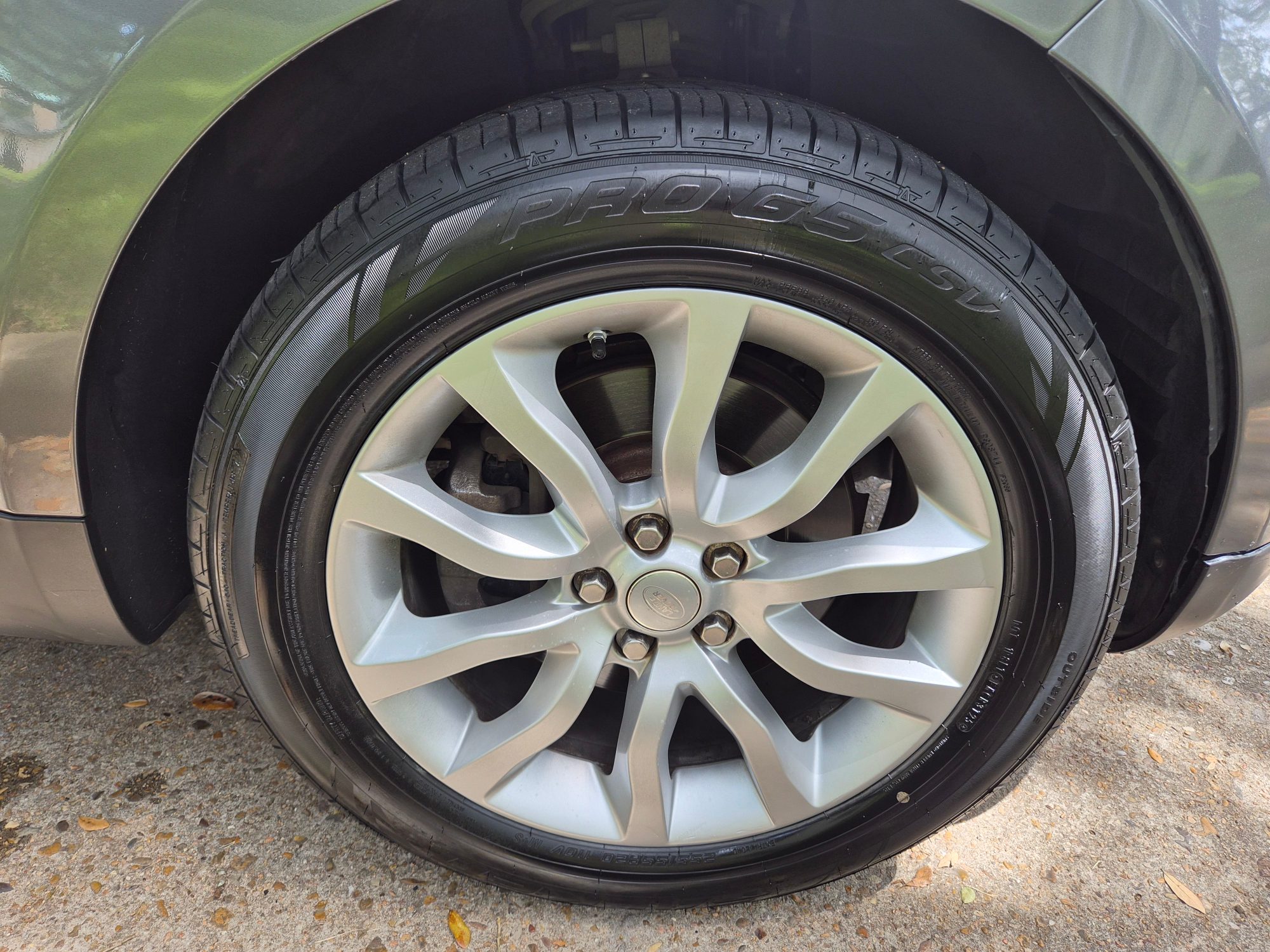 Close-up of alloy wheel and tire mounted on vehicle