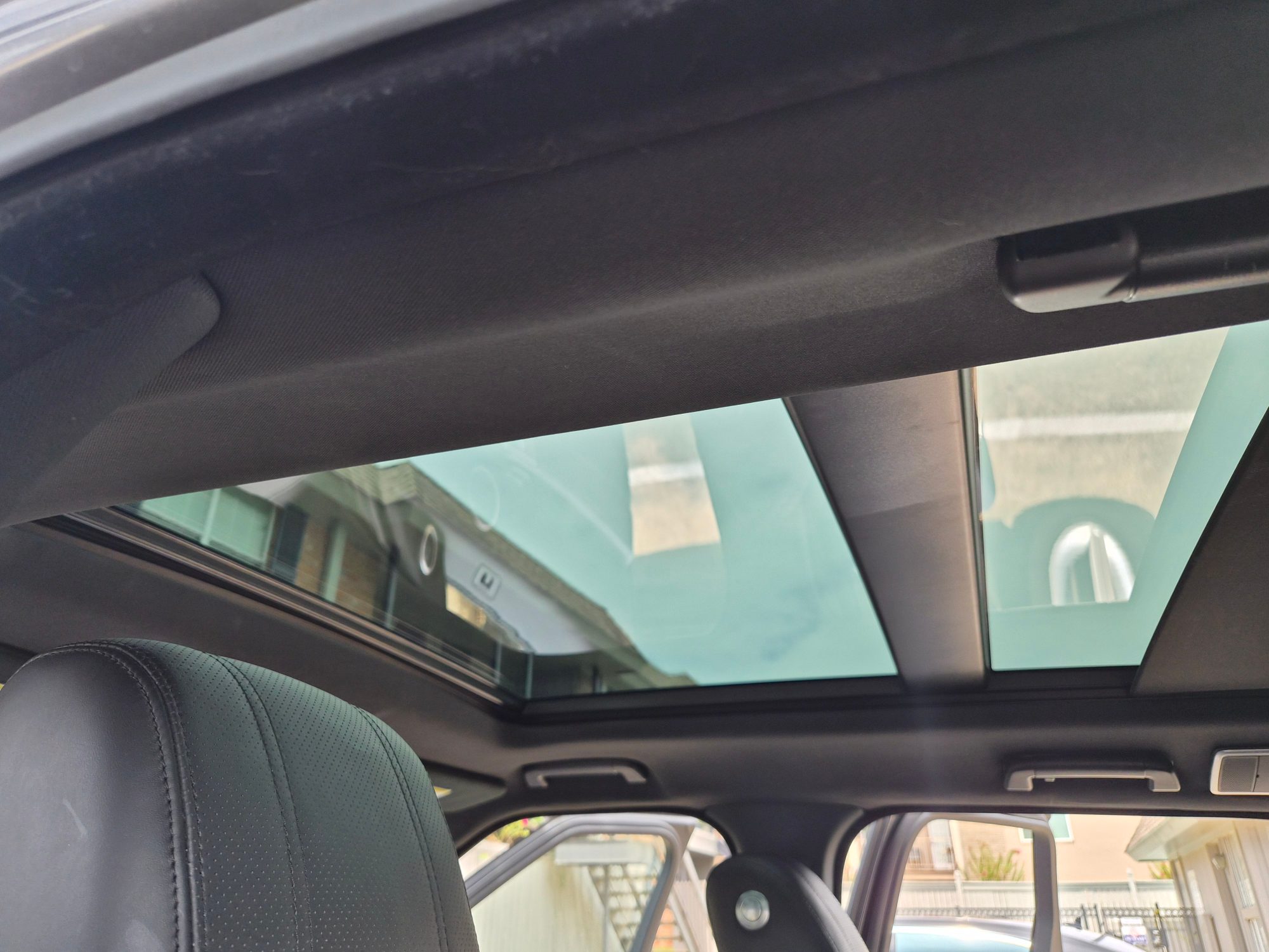 Panoramic glass sunroof viewed from the rear passenger cabin