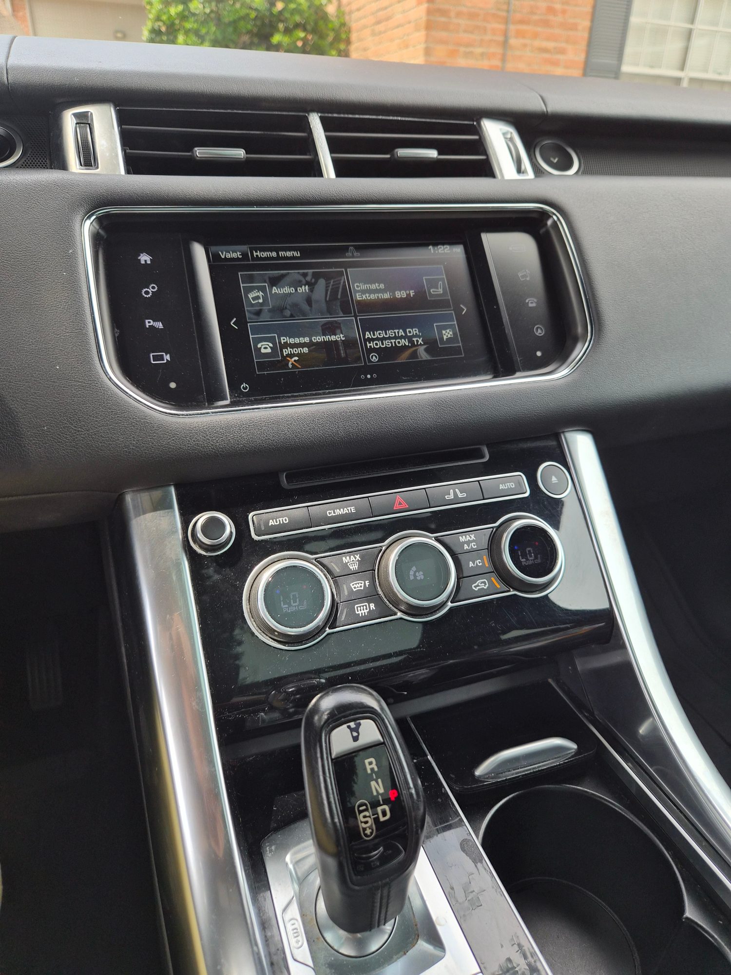 Center console featuring infotainment screen, climate controls, and gear selector.