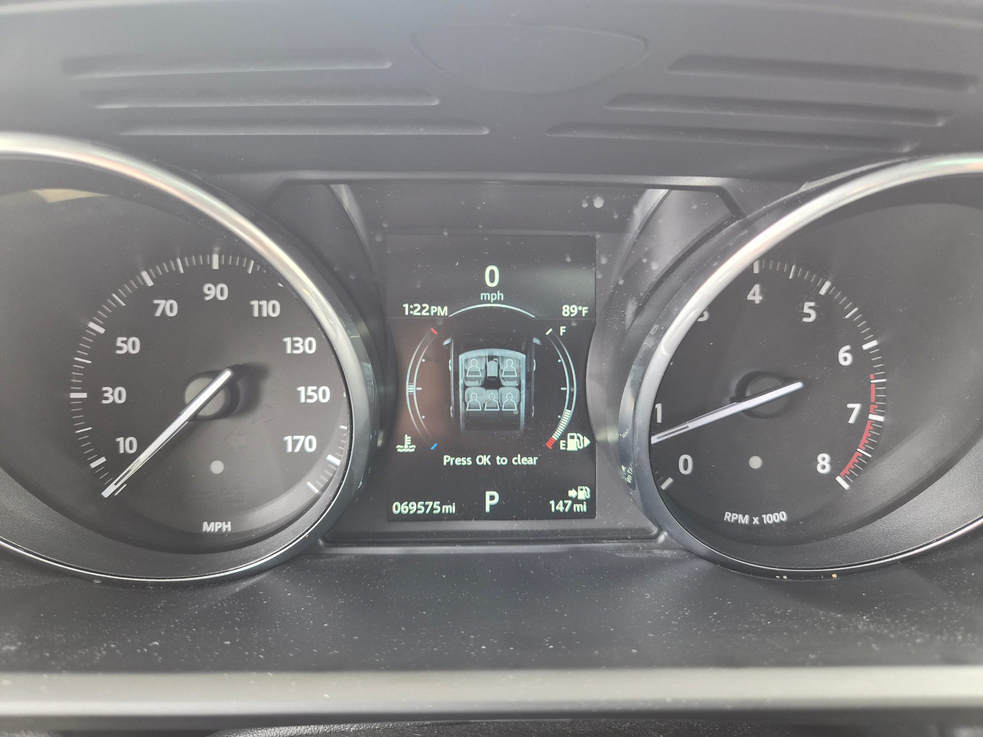 Instrument cluster showing speedometer, tachometer, and digital odometer.