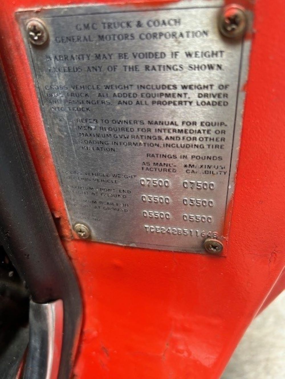 GMC Truck & Coach identification plate and VIN tag on door jamb