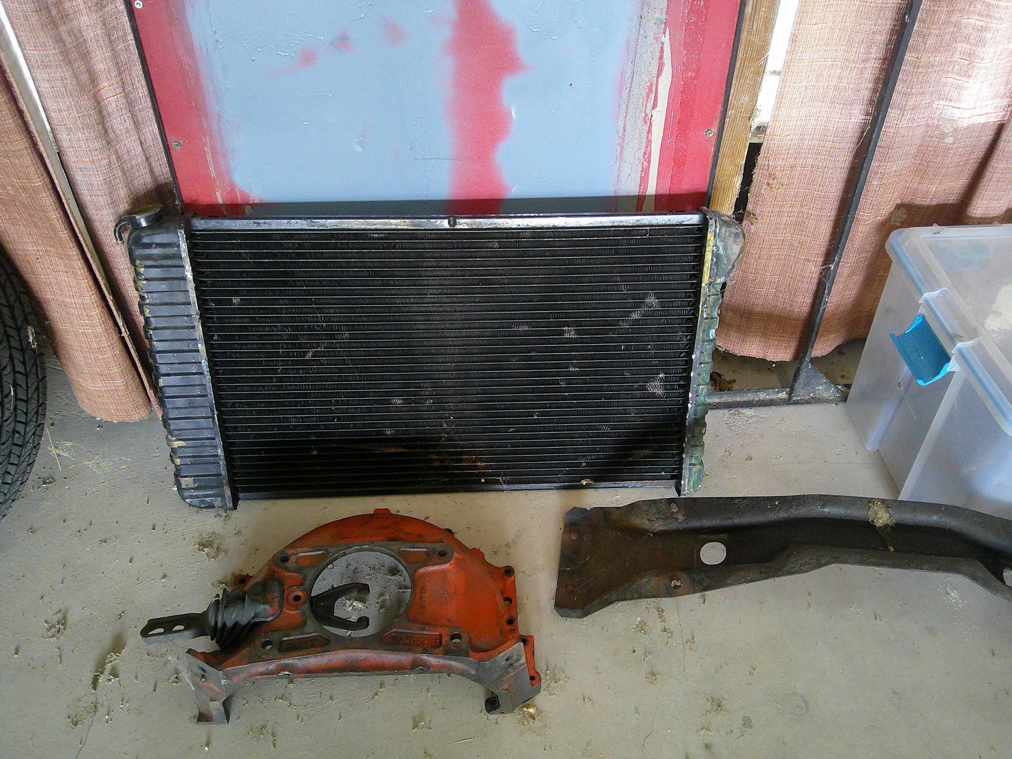 Radiator, bellhousing, and crossmember components removed from vehicle.