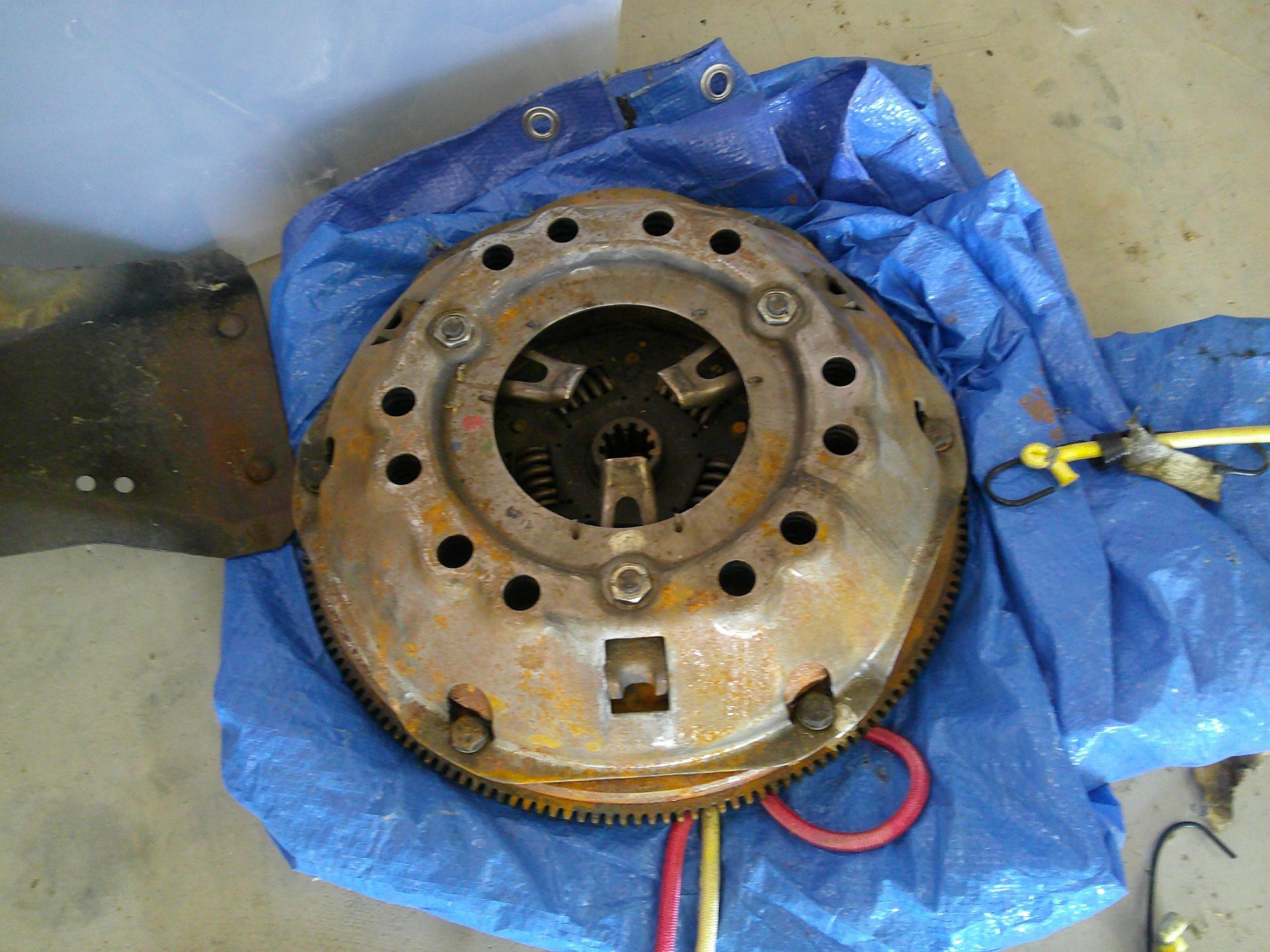 Used clutch assembly with flywheel showing surface oxidation