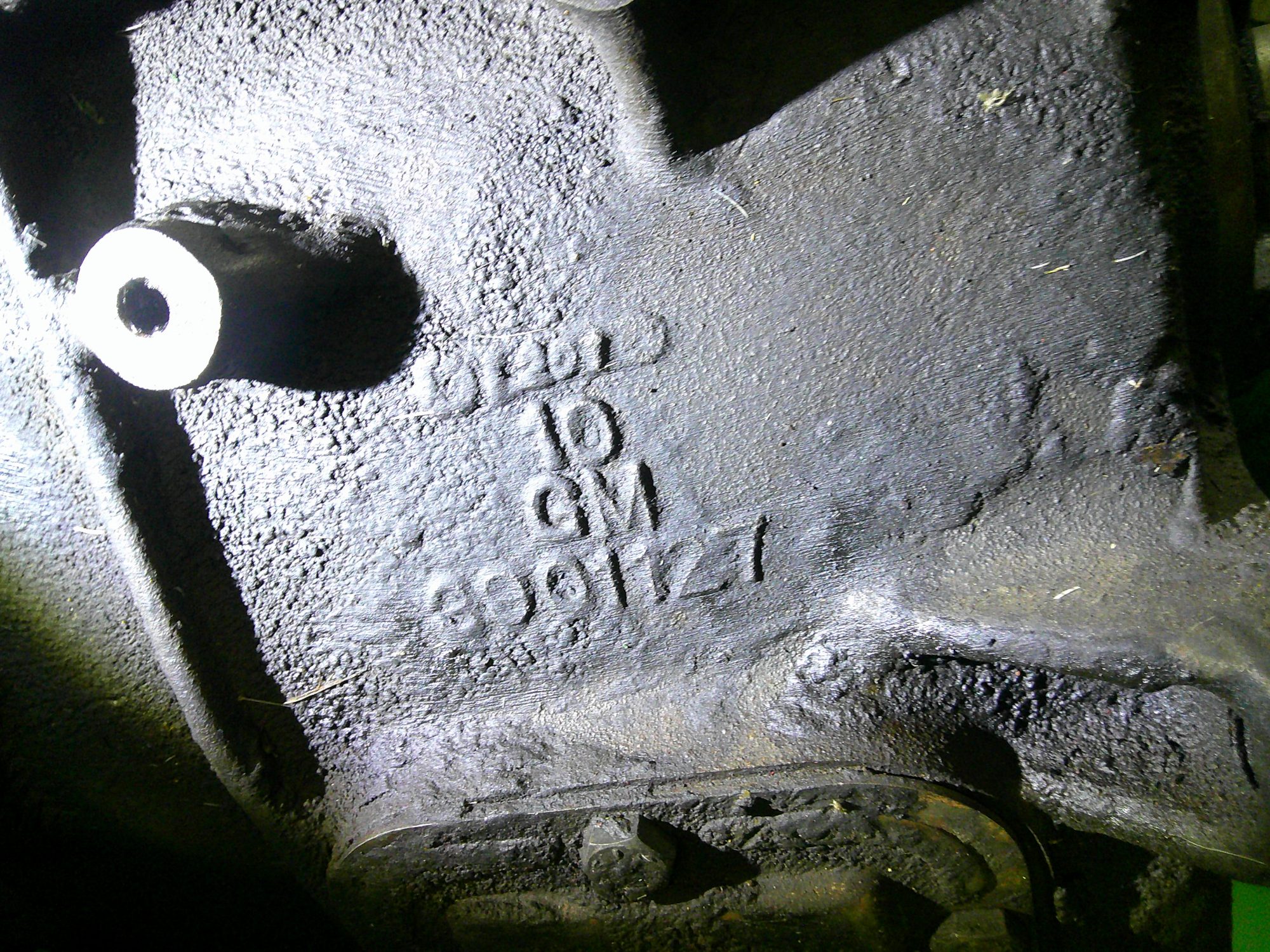 Close-up of GM identification casting numbers on engine block