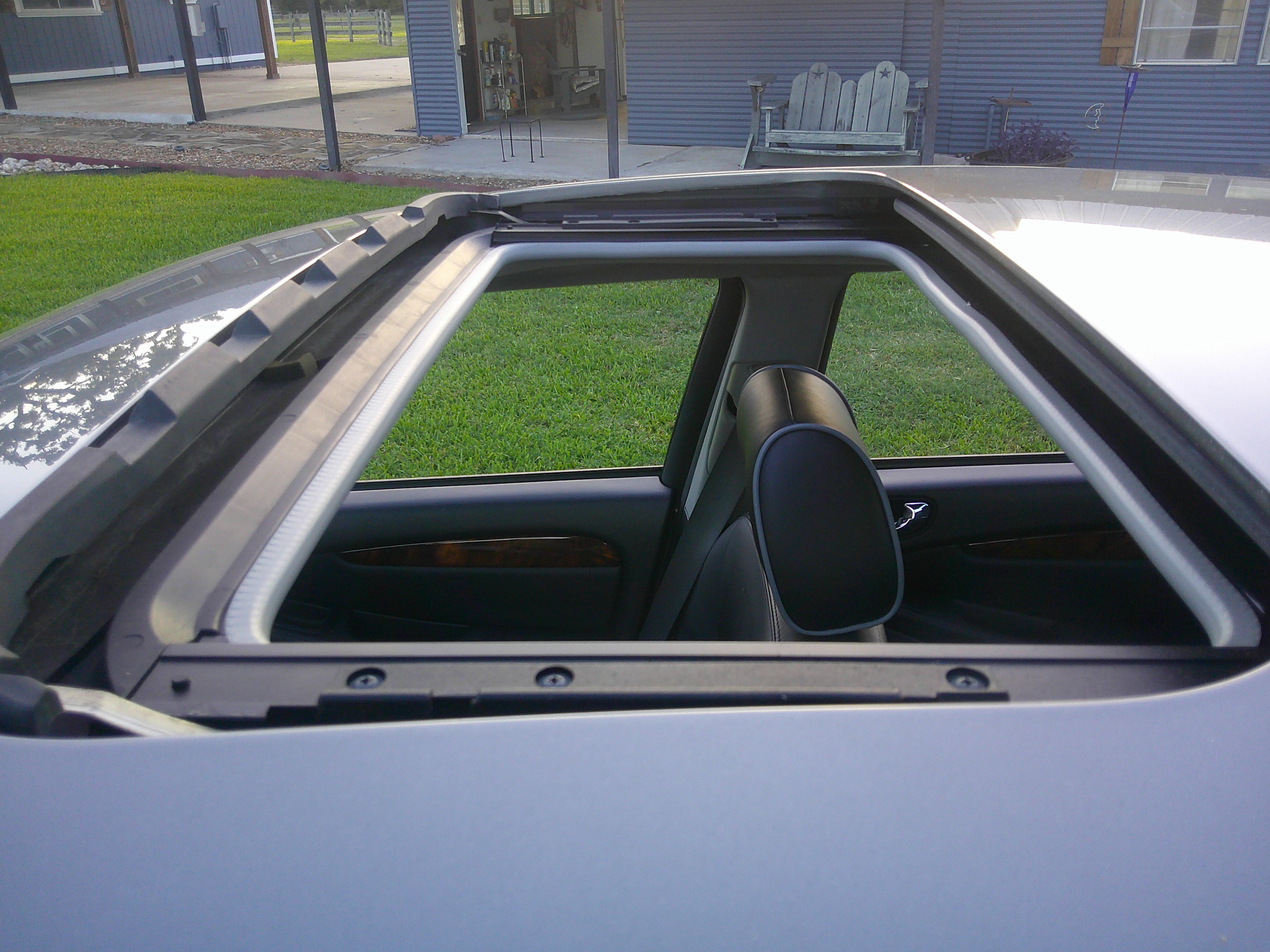 View of the open sunroof from the roof of the vehicle.