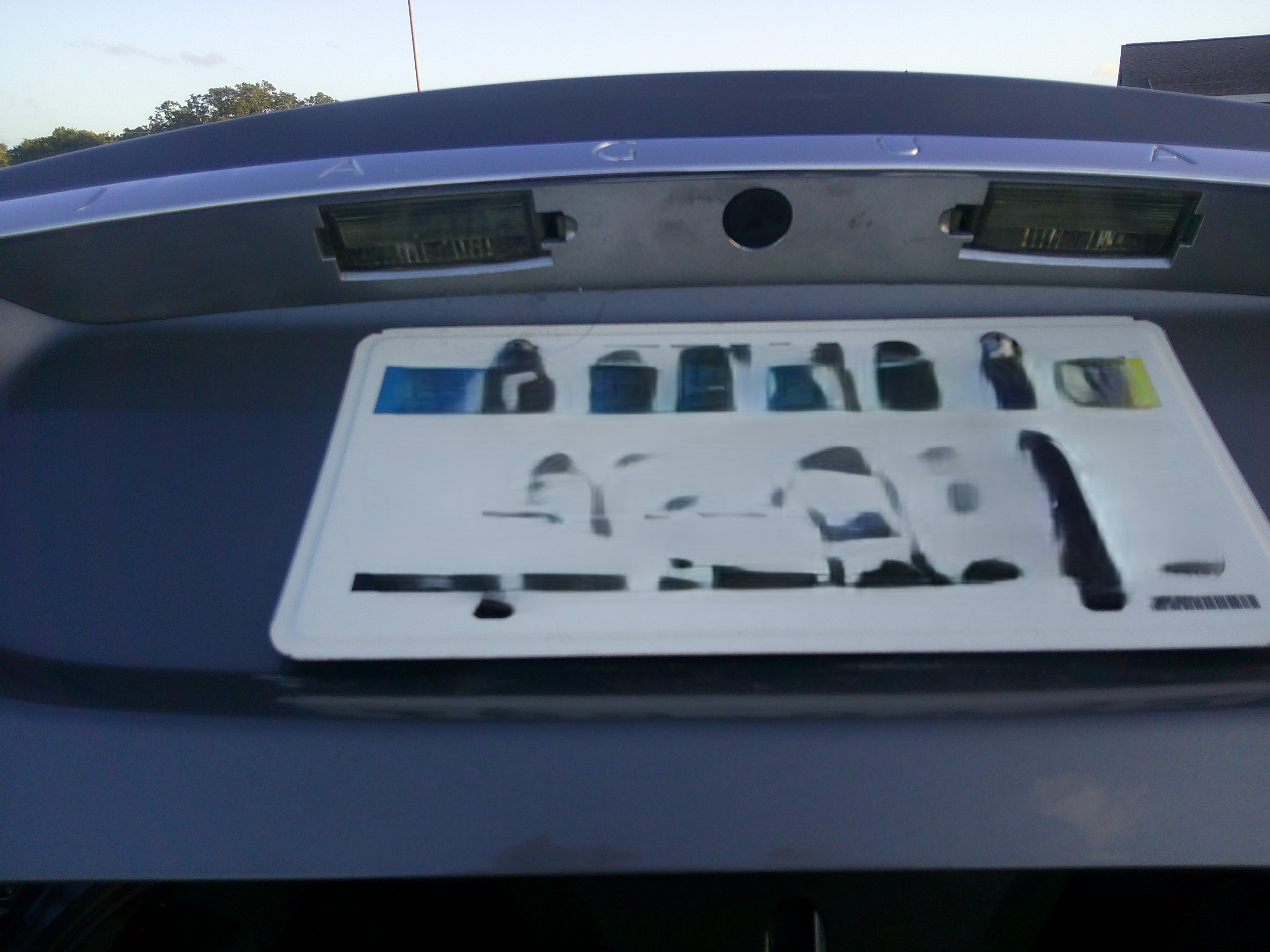 Rear license plate area with trim and light lenses