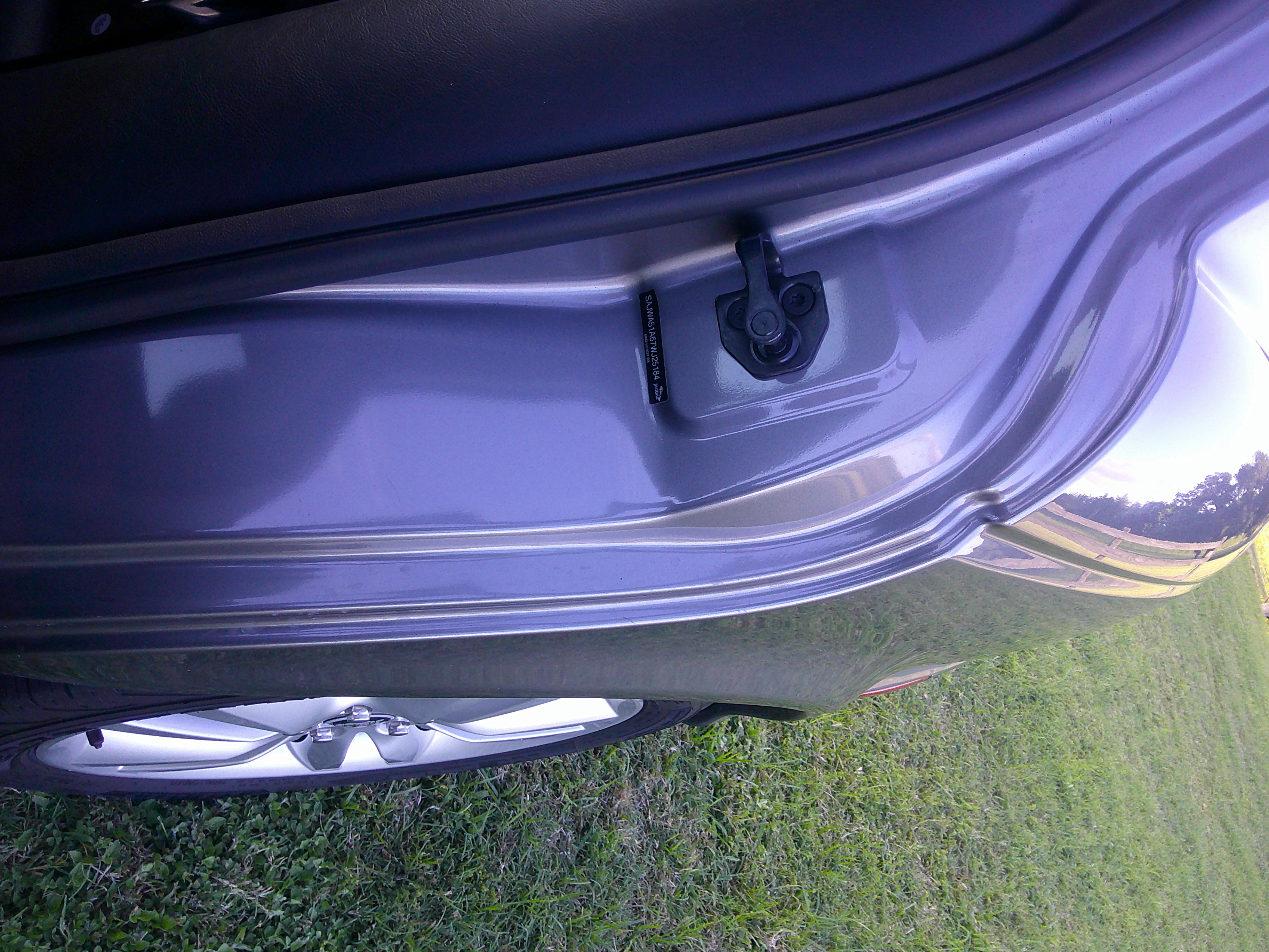 VIN tag and door striker on door jamb