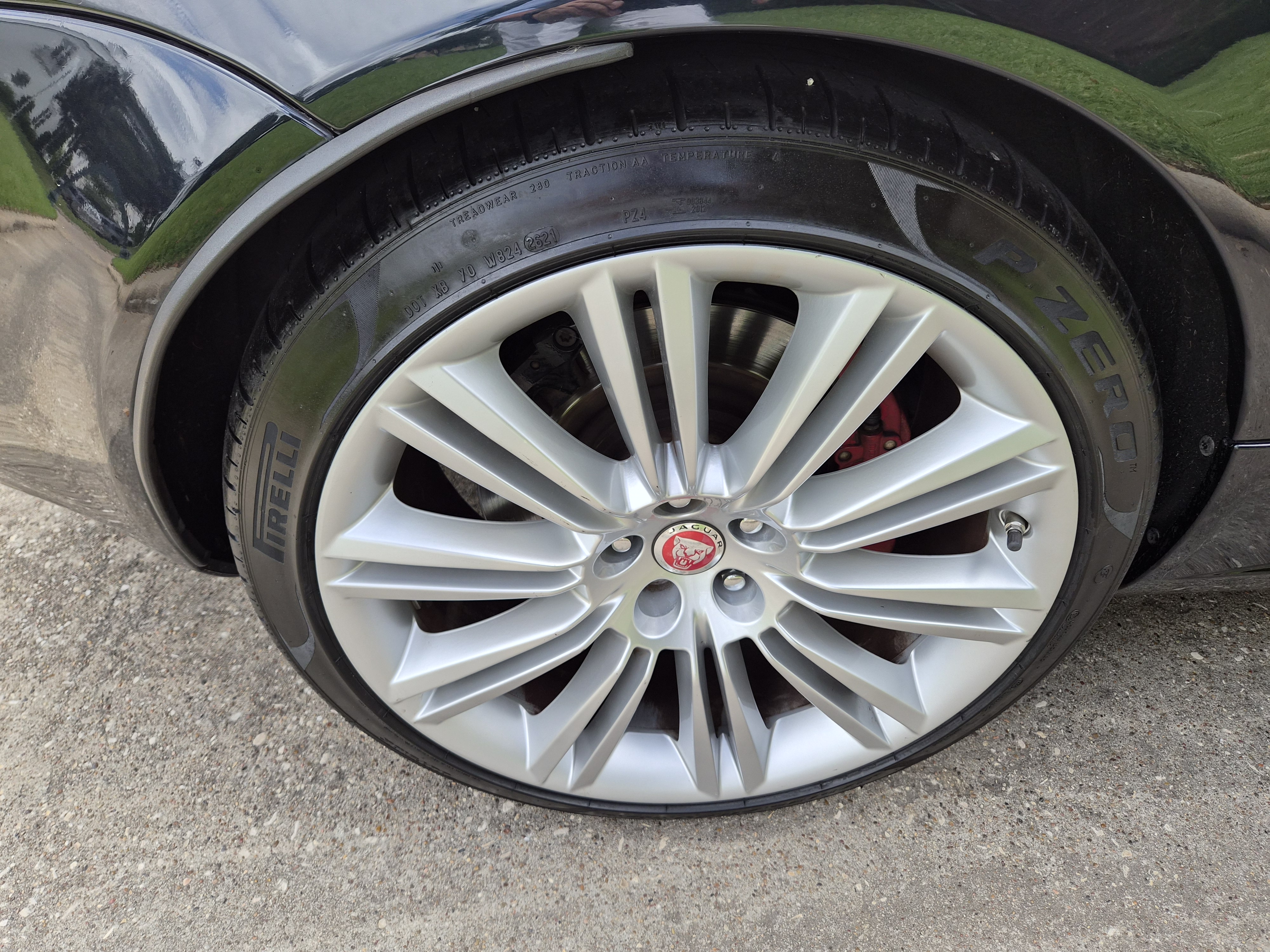 Close-up of Jaguar multi-spoke alloy wheel with Pirelli P Zero tire.