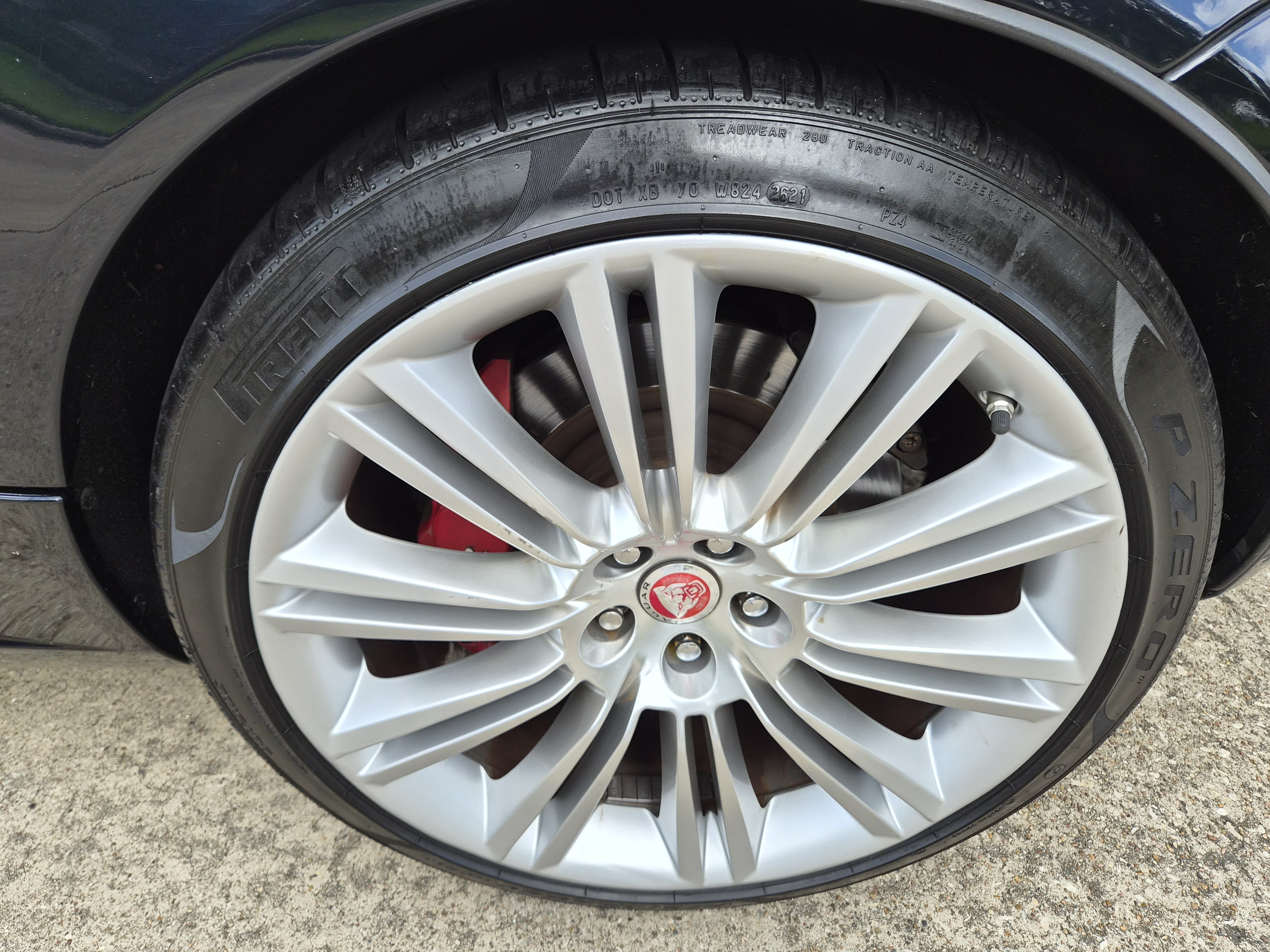 Close-up of alloy wheel and tire showing brake calipers